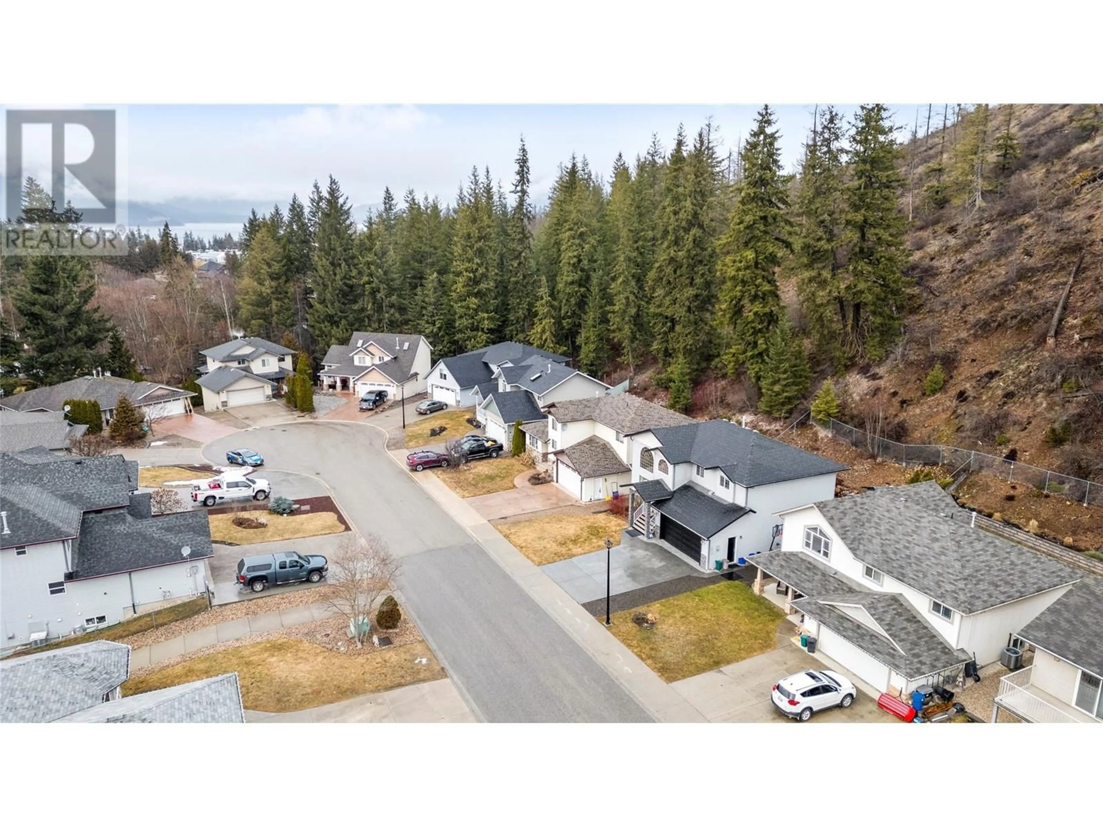 A pic from outside/outdoor area/front of a property/back of a property/a pic from drone, mountain view for 760 37 Street SE, Salmon Arm British Columbia V1E3M2