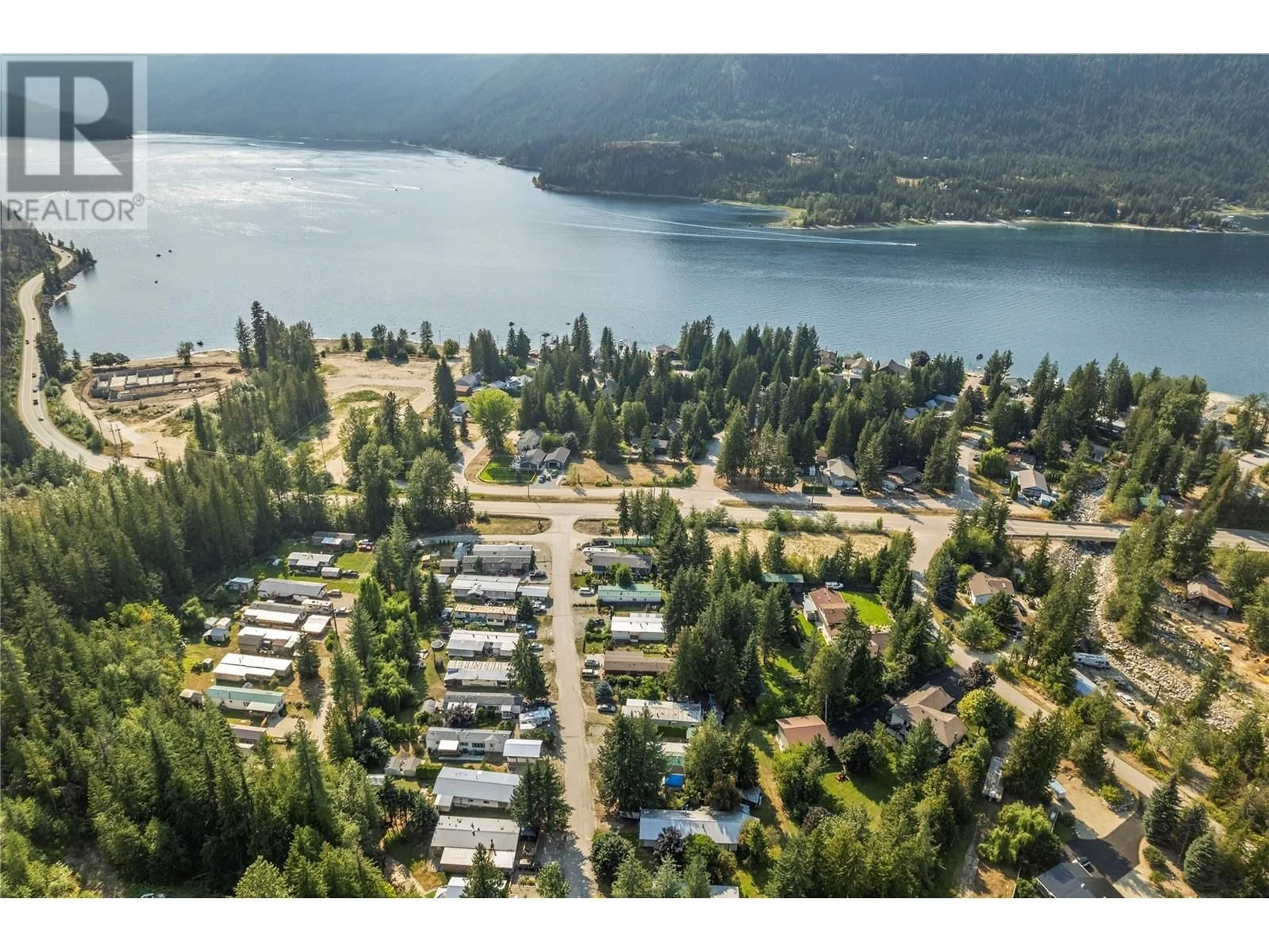 A pic from outside/outdoor area/front of a property/back of a property/a pic from drone, water/lake/river/ocean view for 5 97A Highway Unit# 30, Sicamous British Columbia V0E2V0