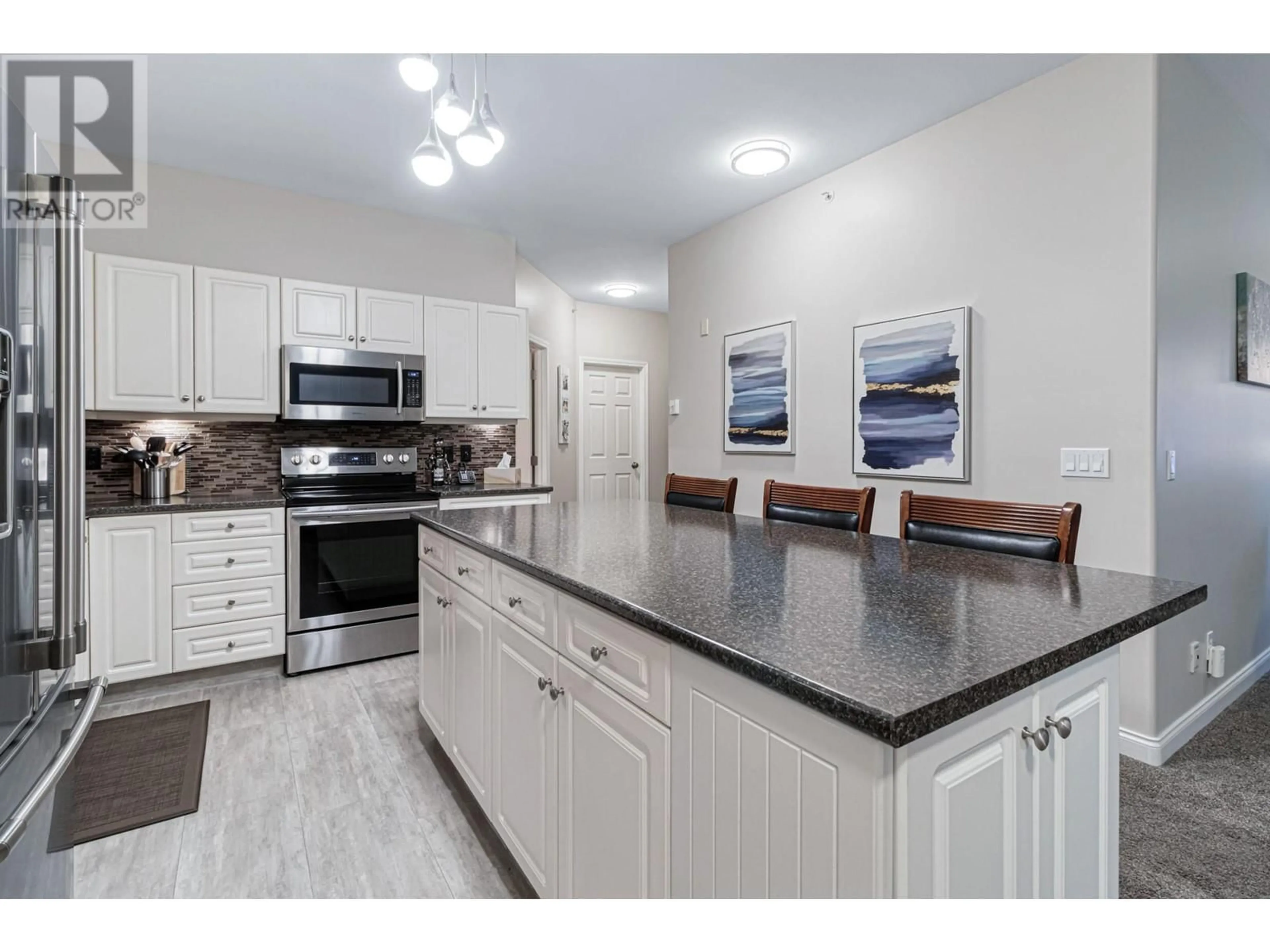 Open concept kitchen, ceramic/tile floor for 407 - 1950 DURNIN ROAD, Kelowna British Columbia V1X7W6