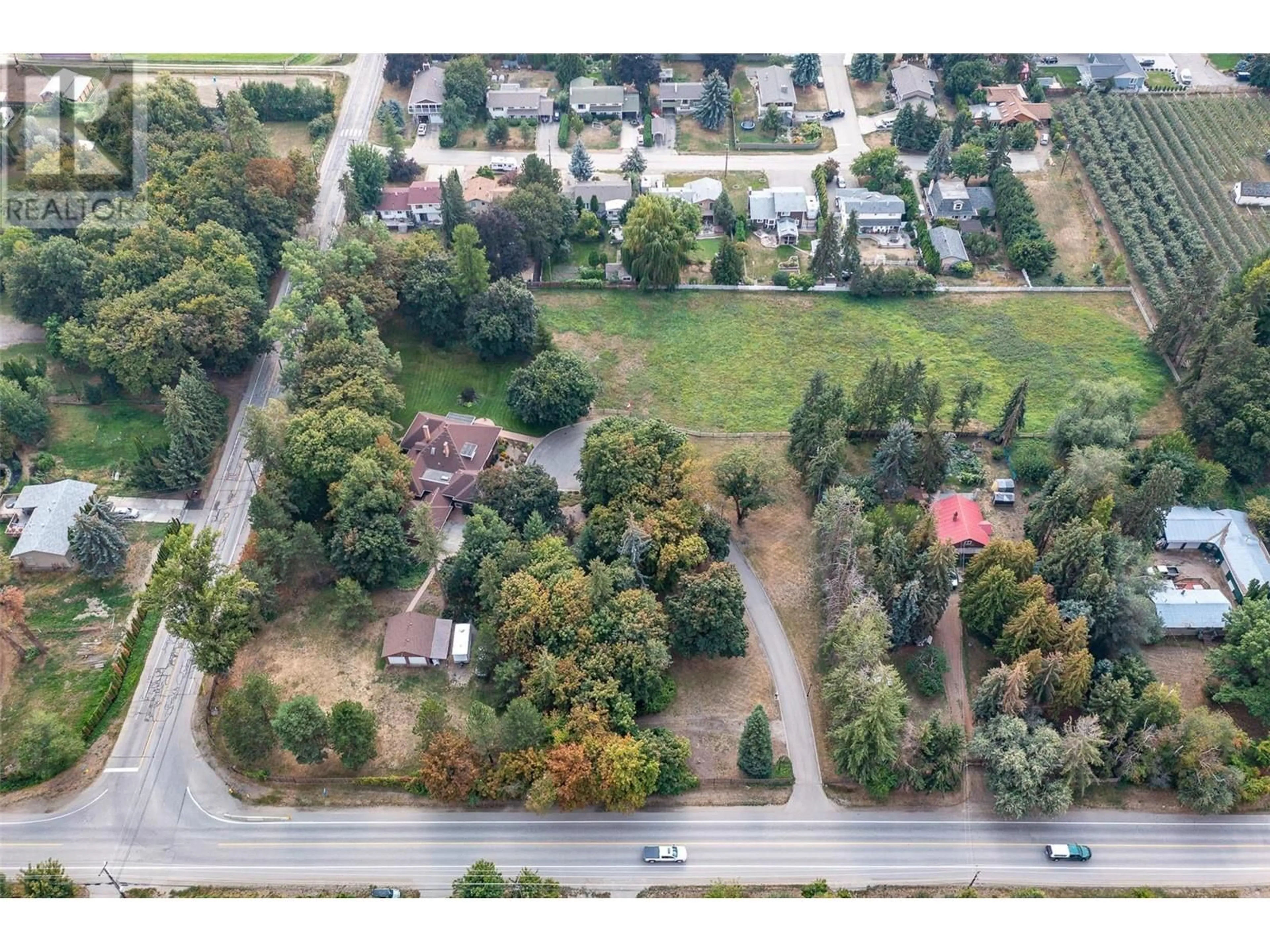 A pic from outside/outdoor area/front of a property/back of a property/a pic from drone, street for 9310 Kalamalka Road, Coldstream British Columbia V1B1L1