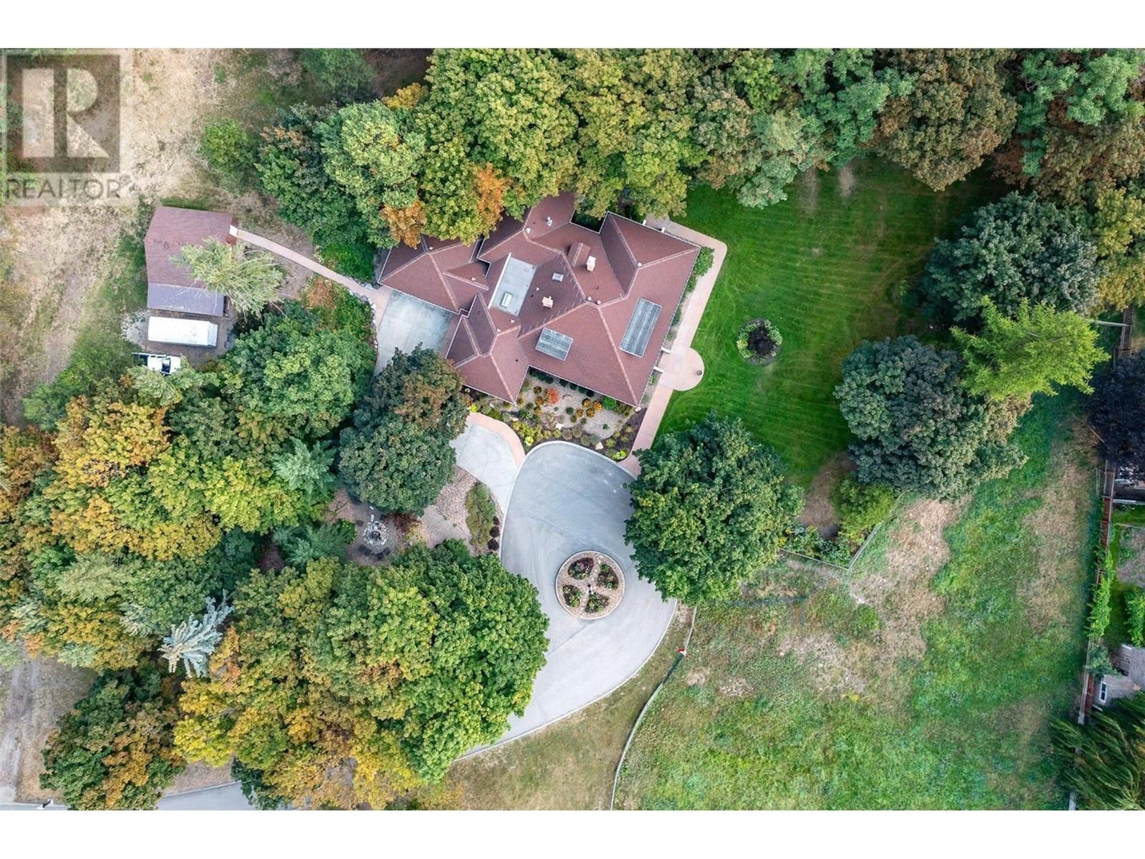 A pic from outside/outdoor area/front of a property/back of a property/a pic from drone, unknown for 9310 Kalamalka Road, Coldstream British Columbia V1B1L1