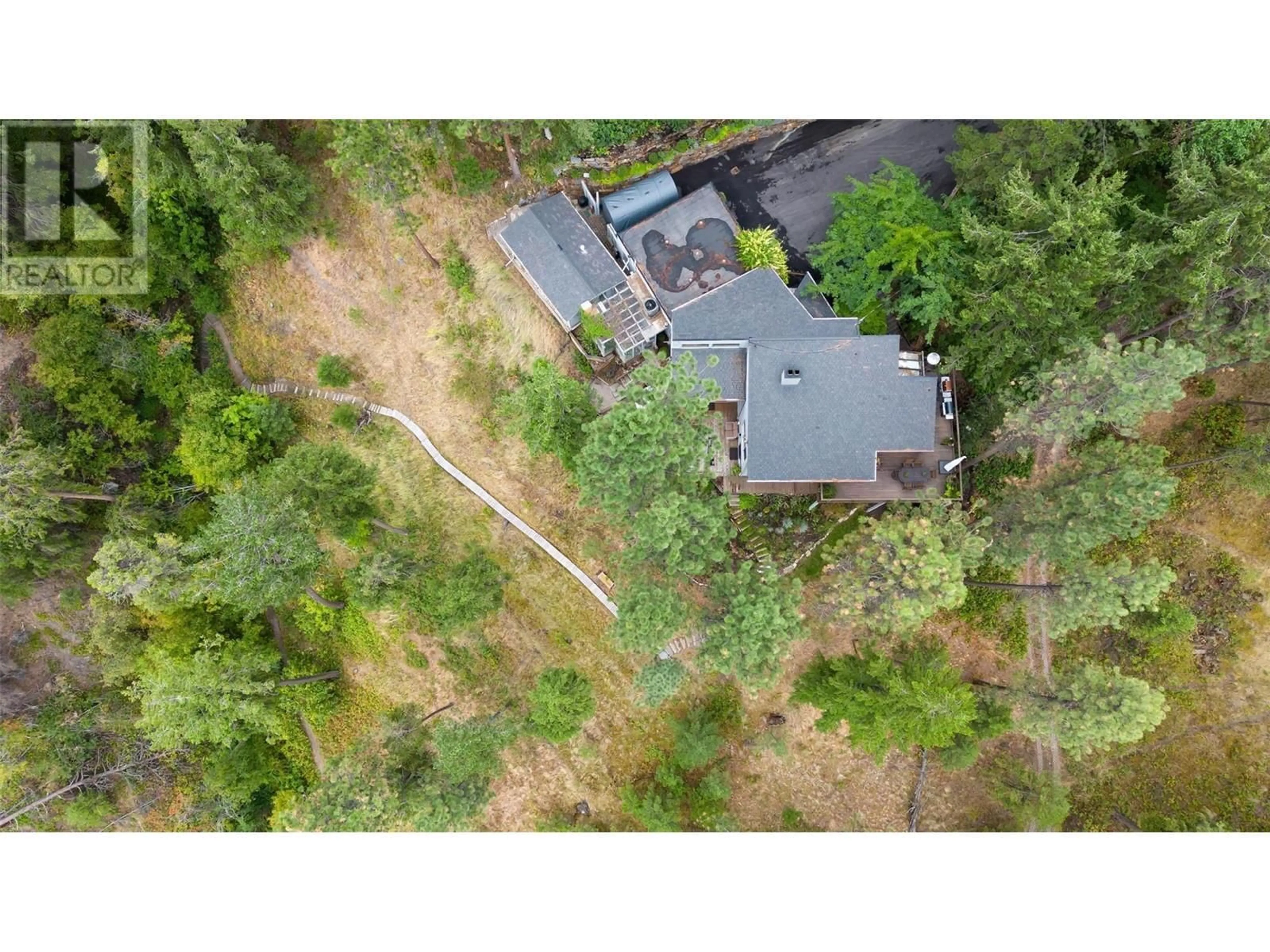 A pic from outside/outdoor area/front of a property/back of a property/a pic from drone, forest/trees view for 2765 ARTHUR ROAD, Kelowna British Columbia V1V2B7
