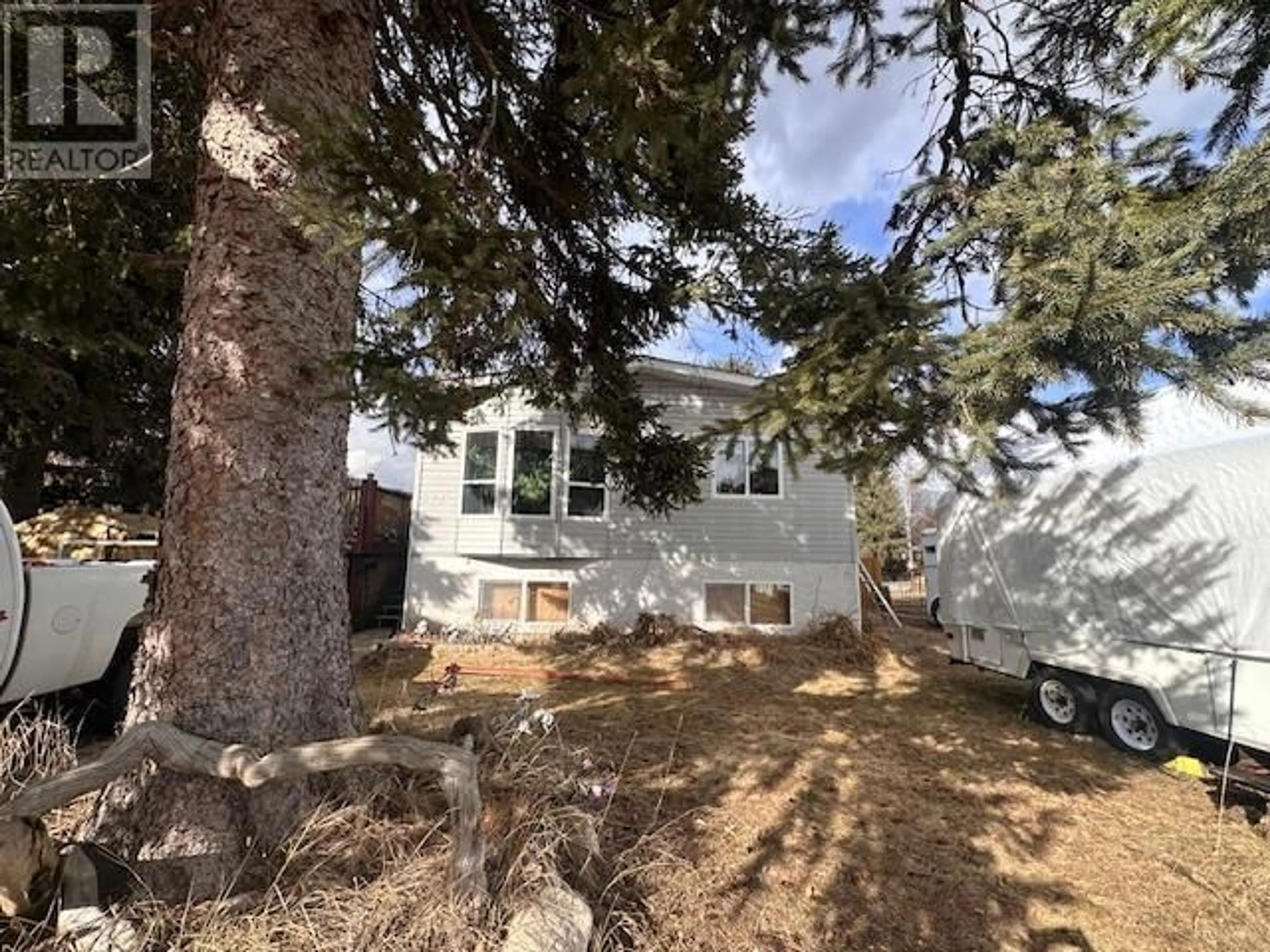 A pic from outside/outdoor area/front of a property/back of a property/a pic from drone, street for 513 105th Street, Castlegar British Columbia V1N3G7