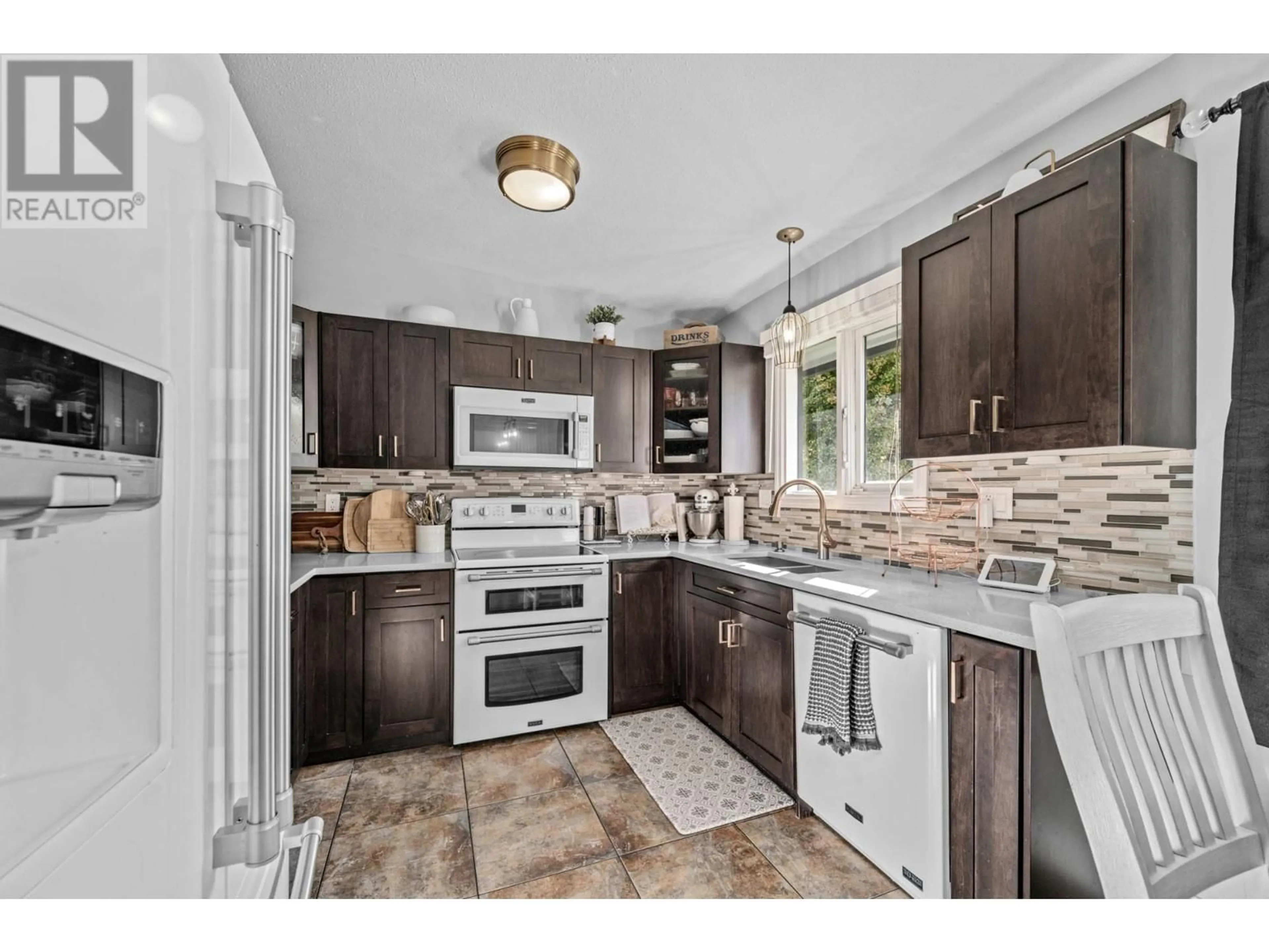 Open concept kitchen, ceramic/tile floor for 1706 CLIFFORD AVENUE, Kamloops British Columbia V2B4G6