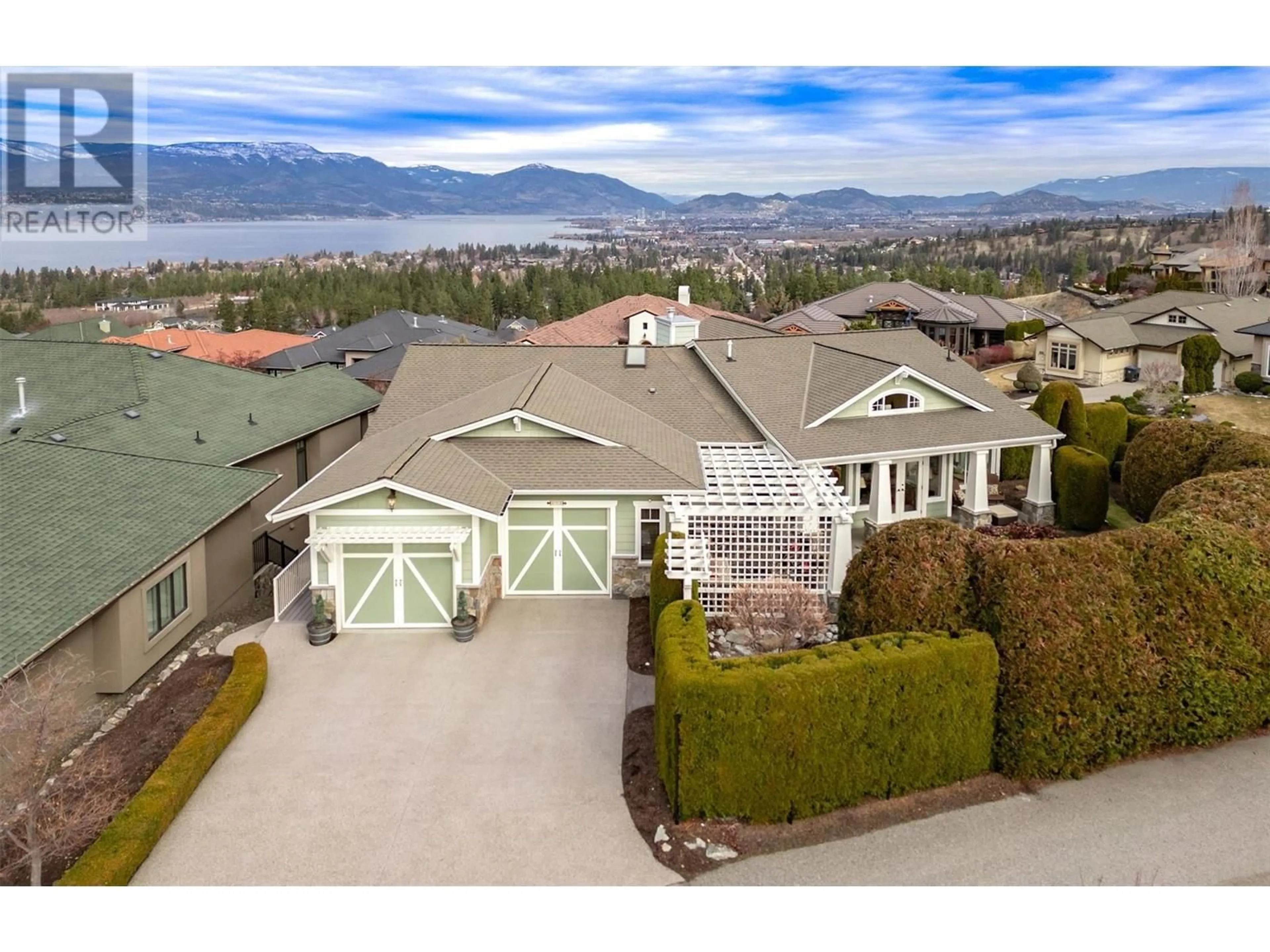 A pic from outside/outdoor area/front of a property/back of a property/a pic from drone, mountain view for 673 Almandine Court, Kelowna British Columbia V1W4Z5