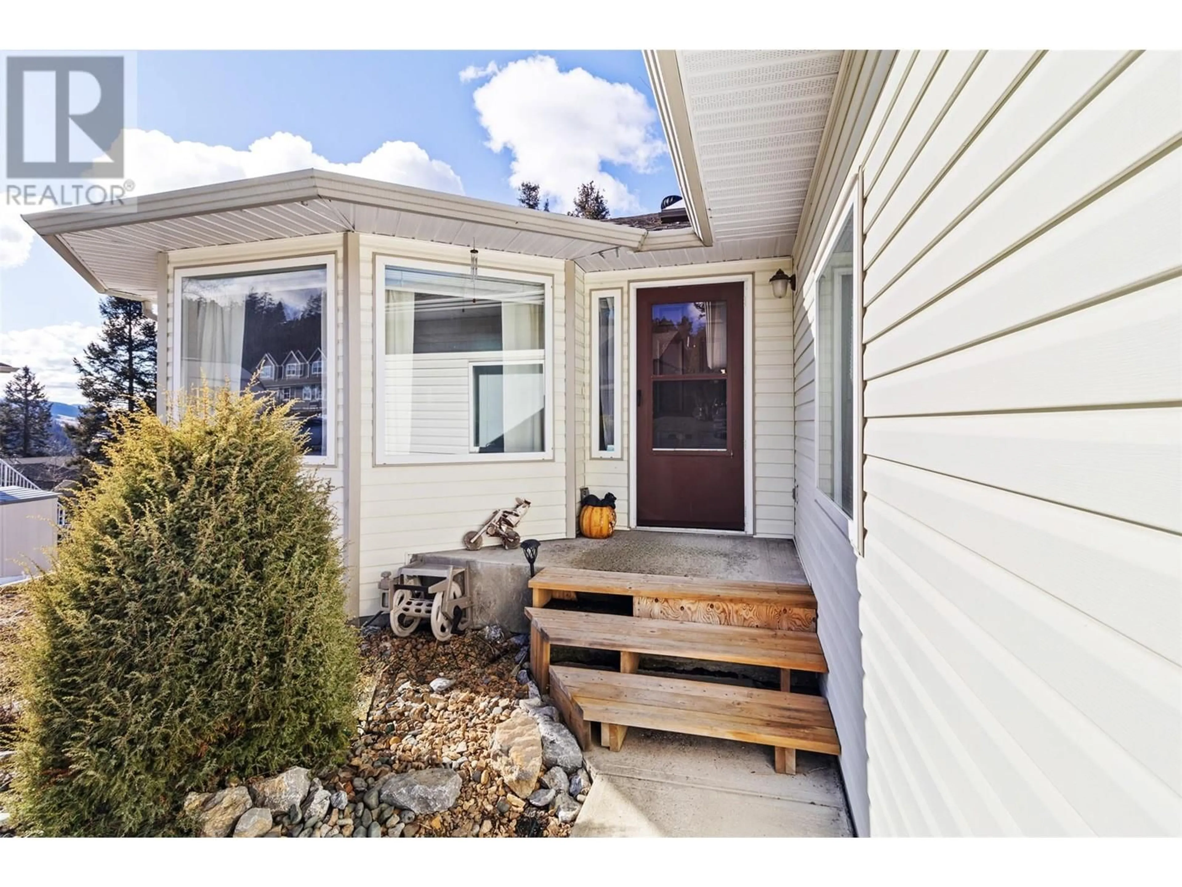 Home with vinyl exterior material, street for 270 CALCITE DRIVE, Logan Lake British Columbia V0K1W0