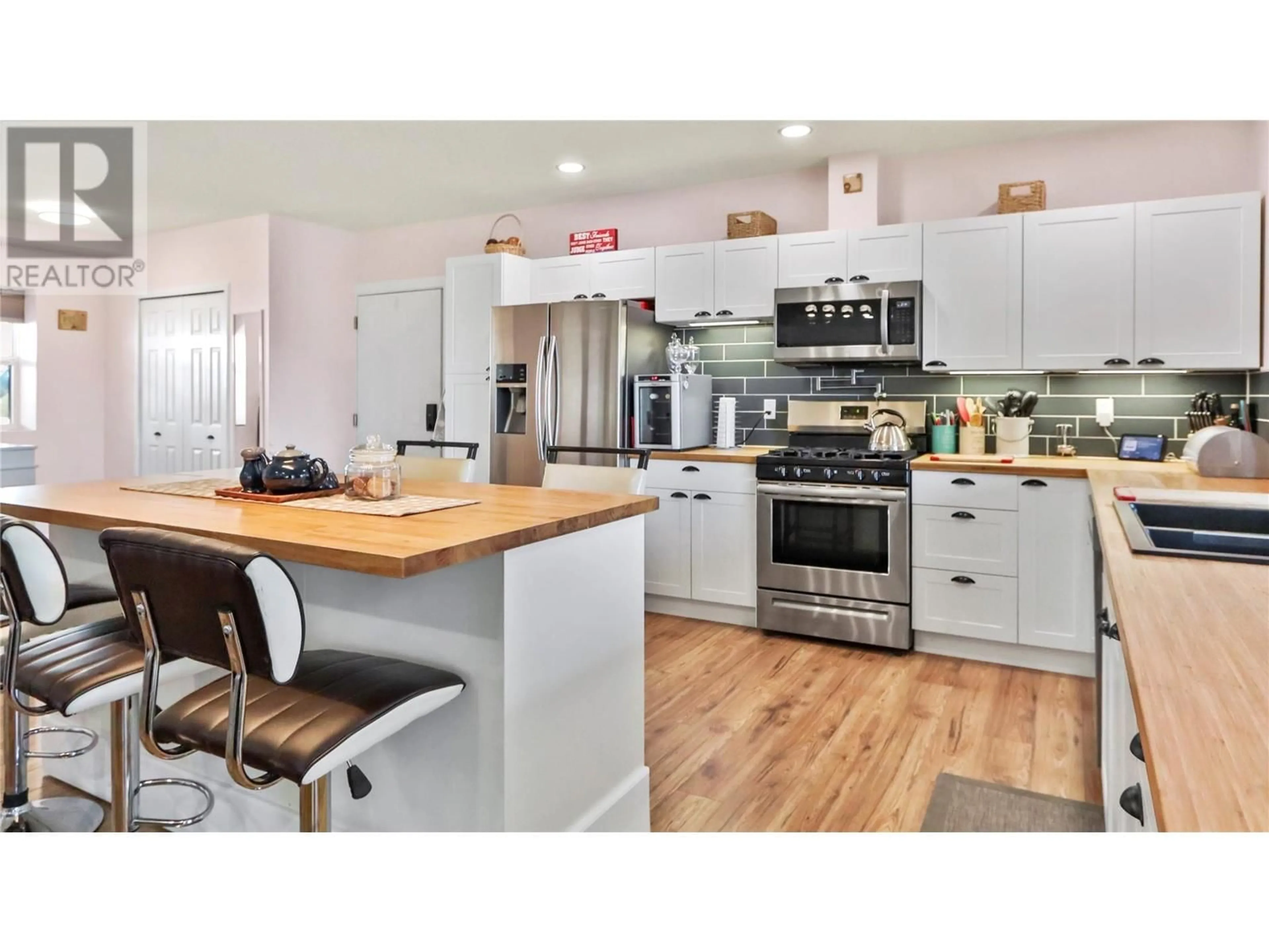 Open concept kitchen, wood/laminate floor for 295 MULE DEER DRIVE, Osoyoos British Columbia V0H1V6