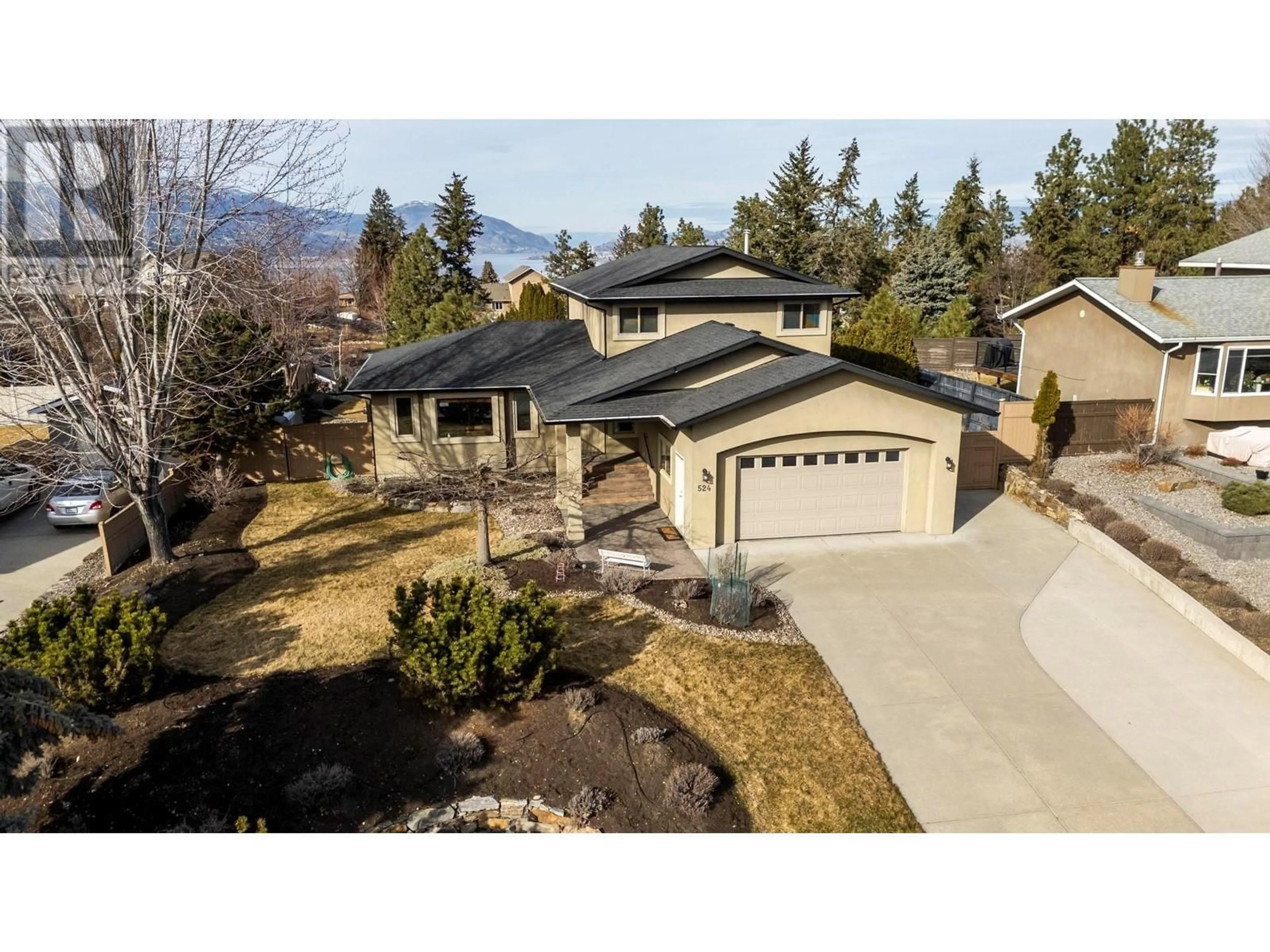 A pic from outside/outdoor area/front of a property/back of a property/a pic from drone, mountain view for 524 Curlew Drive, Kelowna British Columbia V1W4M2