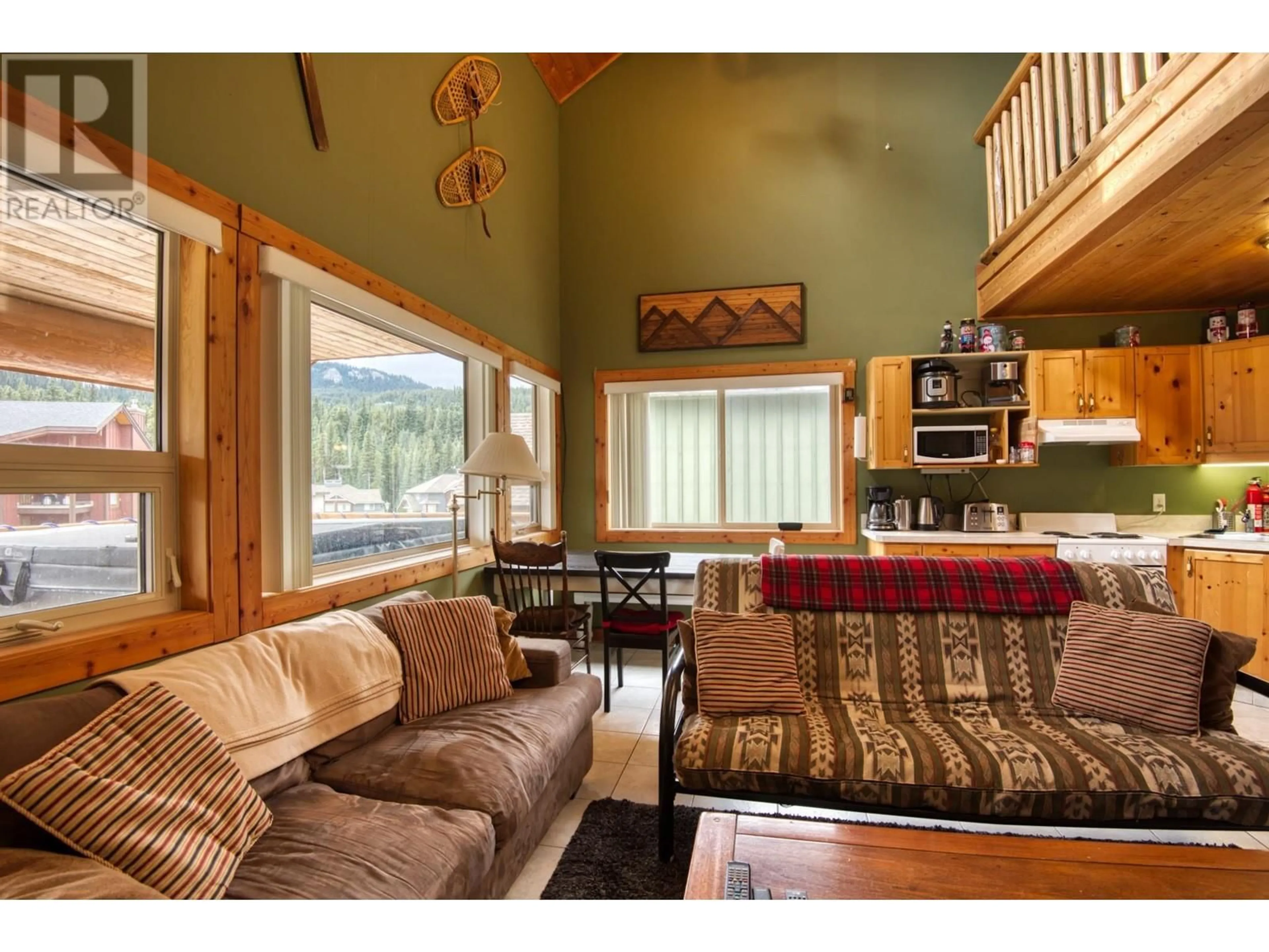 Living room with furniture, wood/laminate floor for 301 - 161 CLEARVIEW CRESCENT, Apex Mountain British Columbia V2A0E2