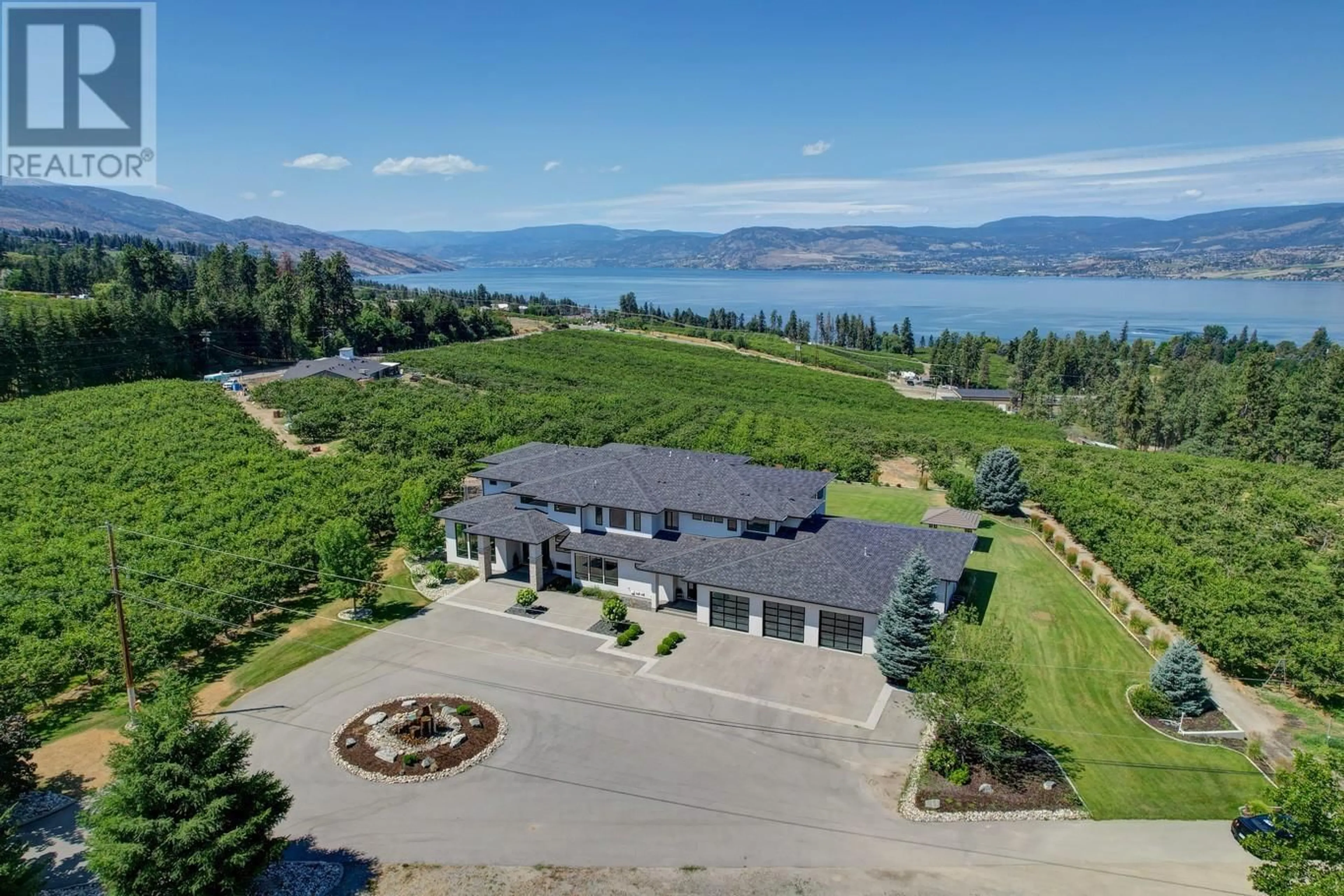 A pic from outside/outdoor area/front of a property/back of a property/a pic from drone, water/lake/river/ocean view for 590 BARNABY ROAD, Kelowna British Columbia V1W4N7
