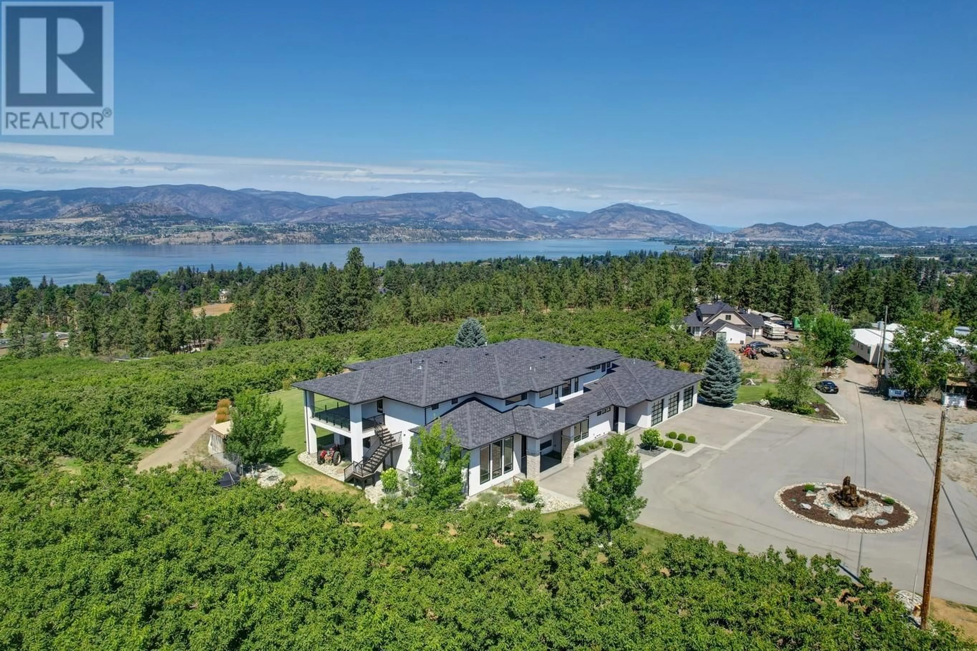 A pic from outside/outdoor area/front of a property/back of a property/a pic from drone, water/lake/river/ocean view for 590 BARNABY ROAD, Kelowna British Columbia V1W4N7