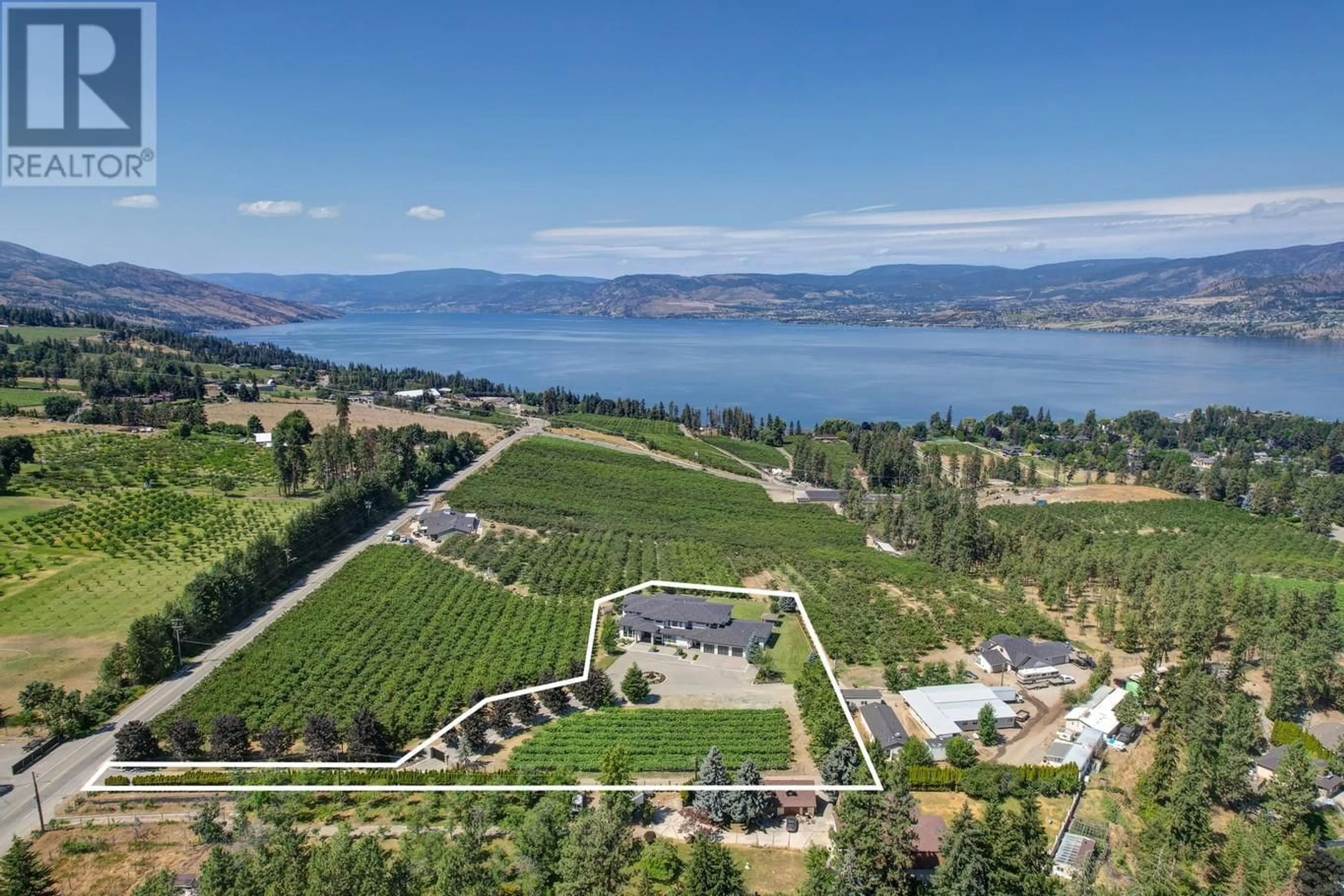 A pic from outside/outdoor area/front of a property/back of a property/a pic from drone, water/lake/river/ocean view for 590 BARNABY ROAD, Kelowna British Columbia V1W4N7