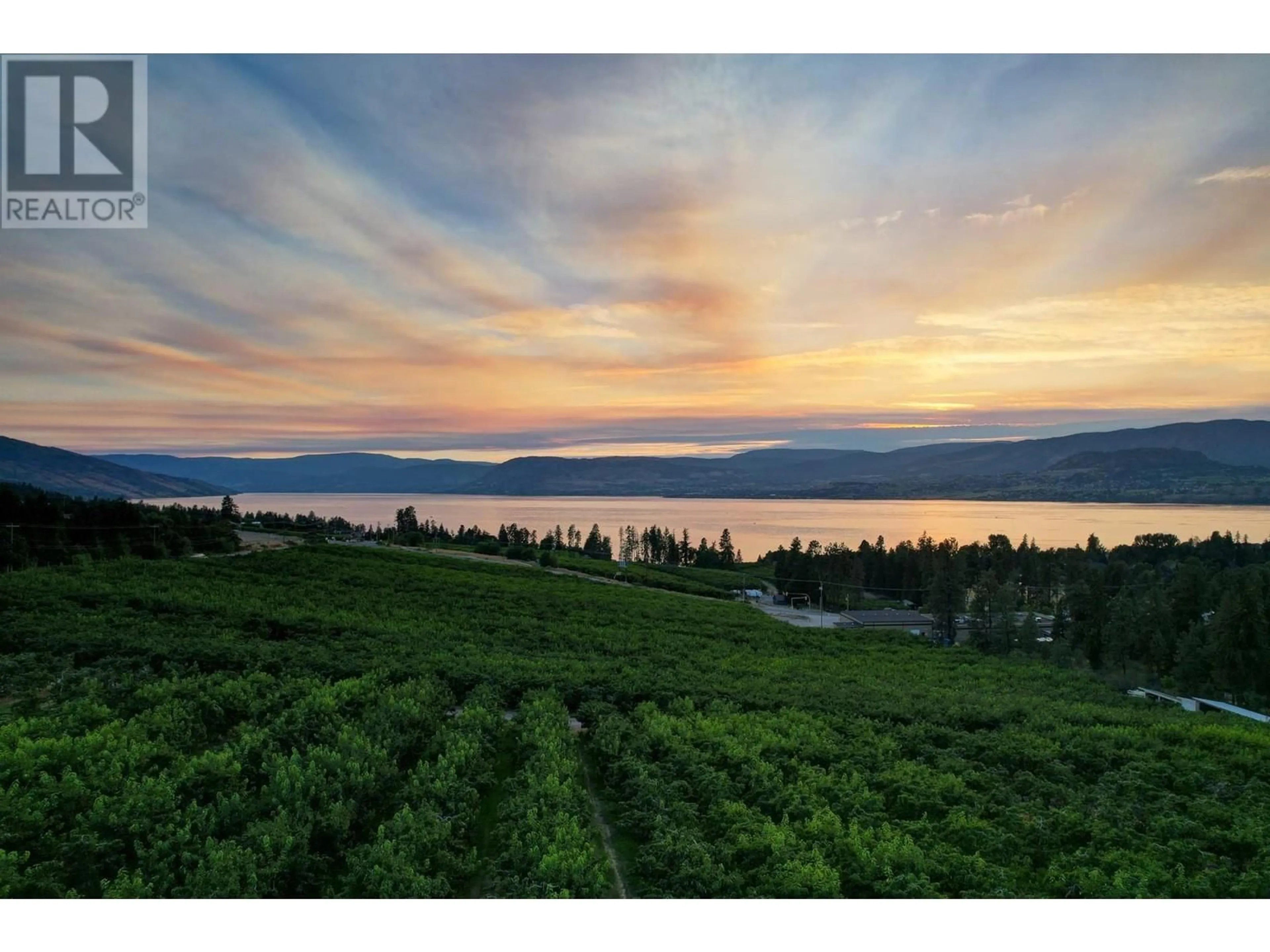 A pic from outside/outdoor area/front of a property/back of a property/a pic from drone, water/lake/river/ocean view for 590 BARNABY ROAD, Kelowna British Columbia V1W4N7