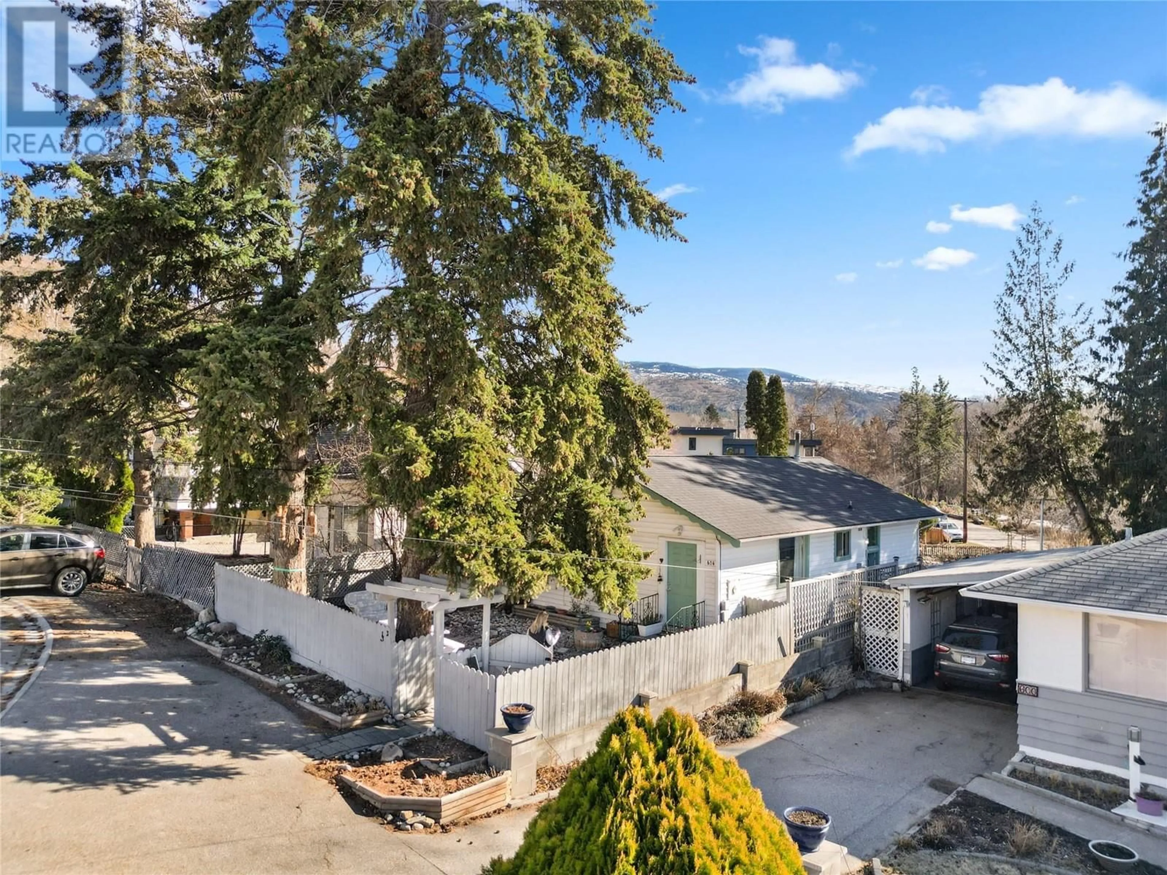 A pic from outside/outdoor area/front of a property/back of a property/a pic from drone, mountain view for 614 Wade Avenue E, Penticton British Columbia V2A1T4