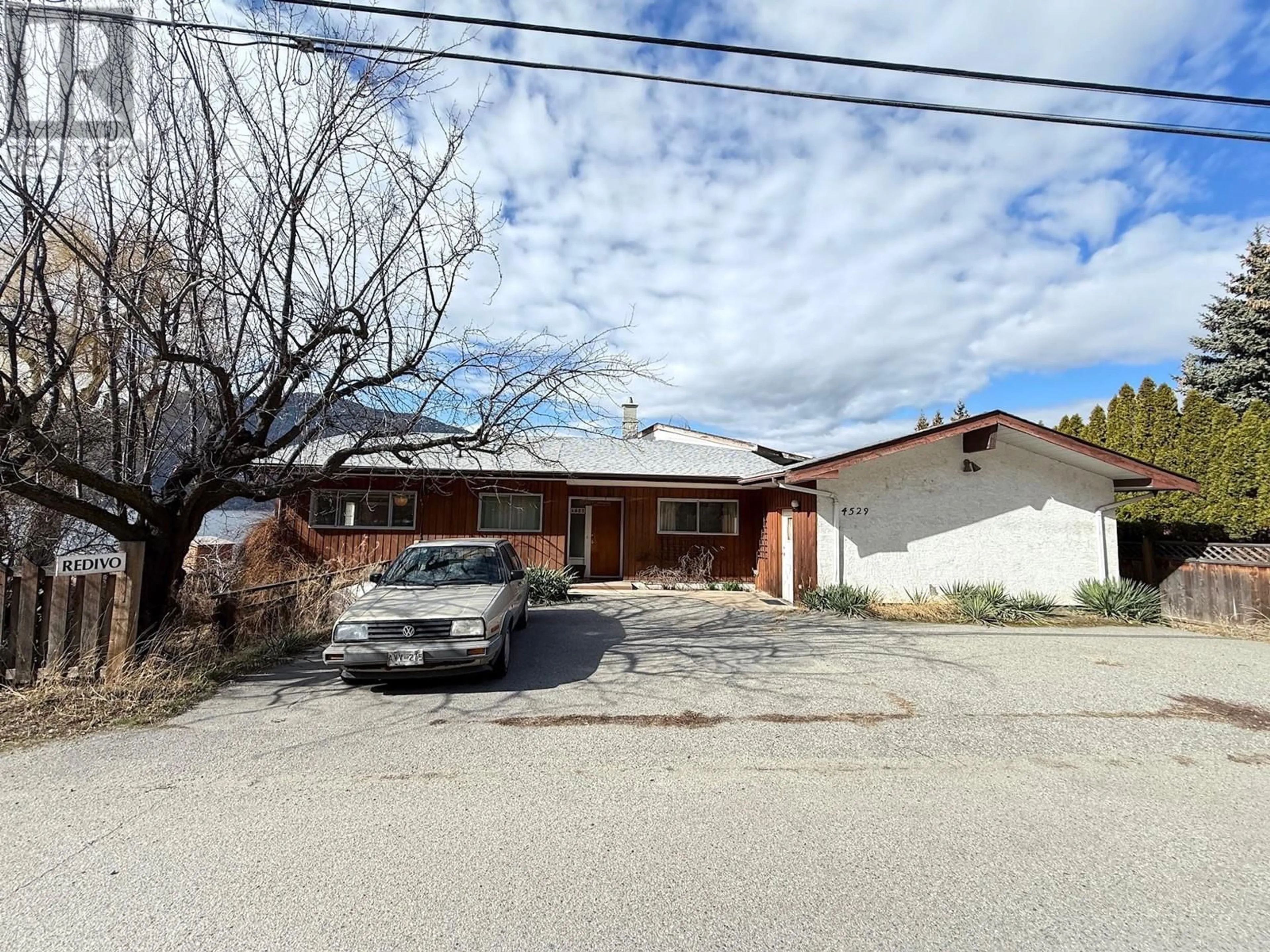 A pic from outside/outdoor area/front of a property/back of a property/a pic from drone, street for 4529 Lakeside Road, Penticton British Columbia V2A8W4