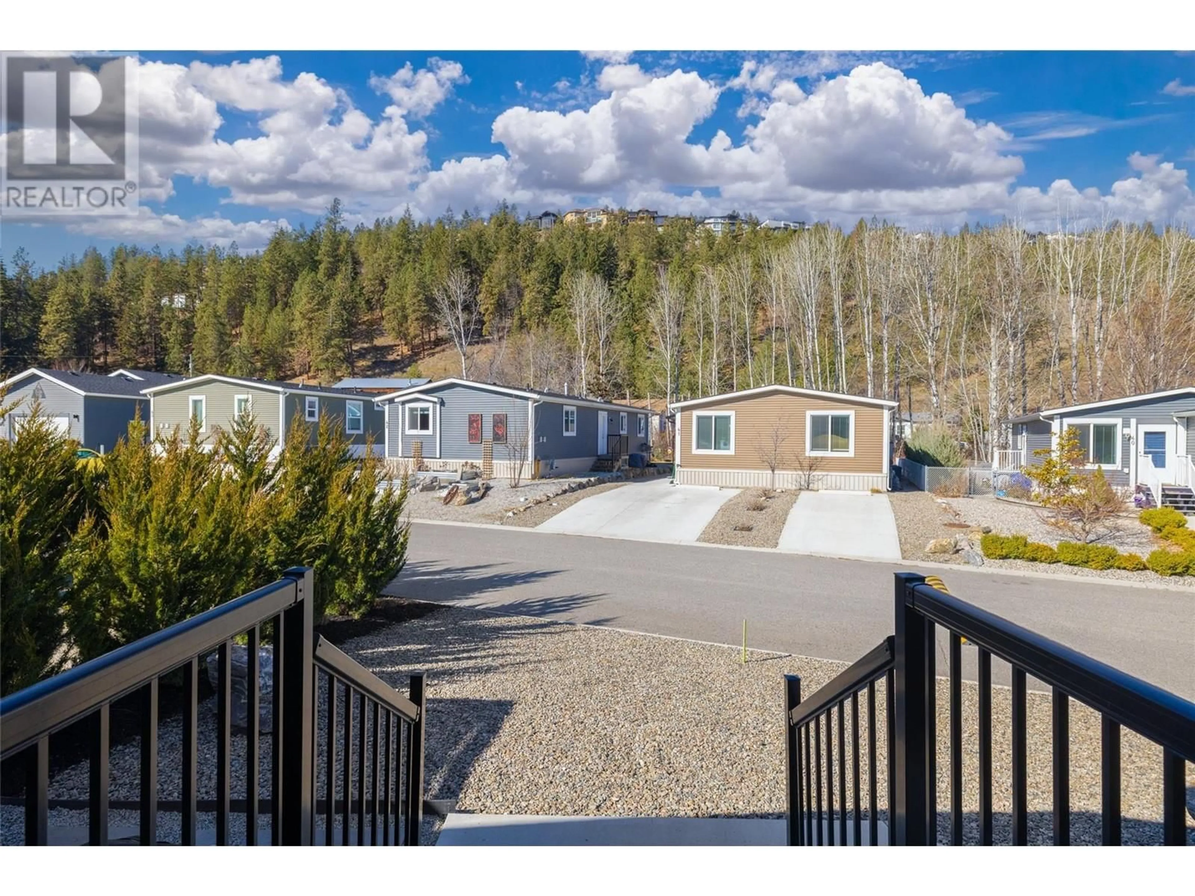 A pic from outside/outdoor area/front of a property/back of a property/a pic from drone, mountain view for 70 - 1835 NANCEE WAY COURT, Kelowna British Columbia V1Z4C1