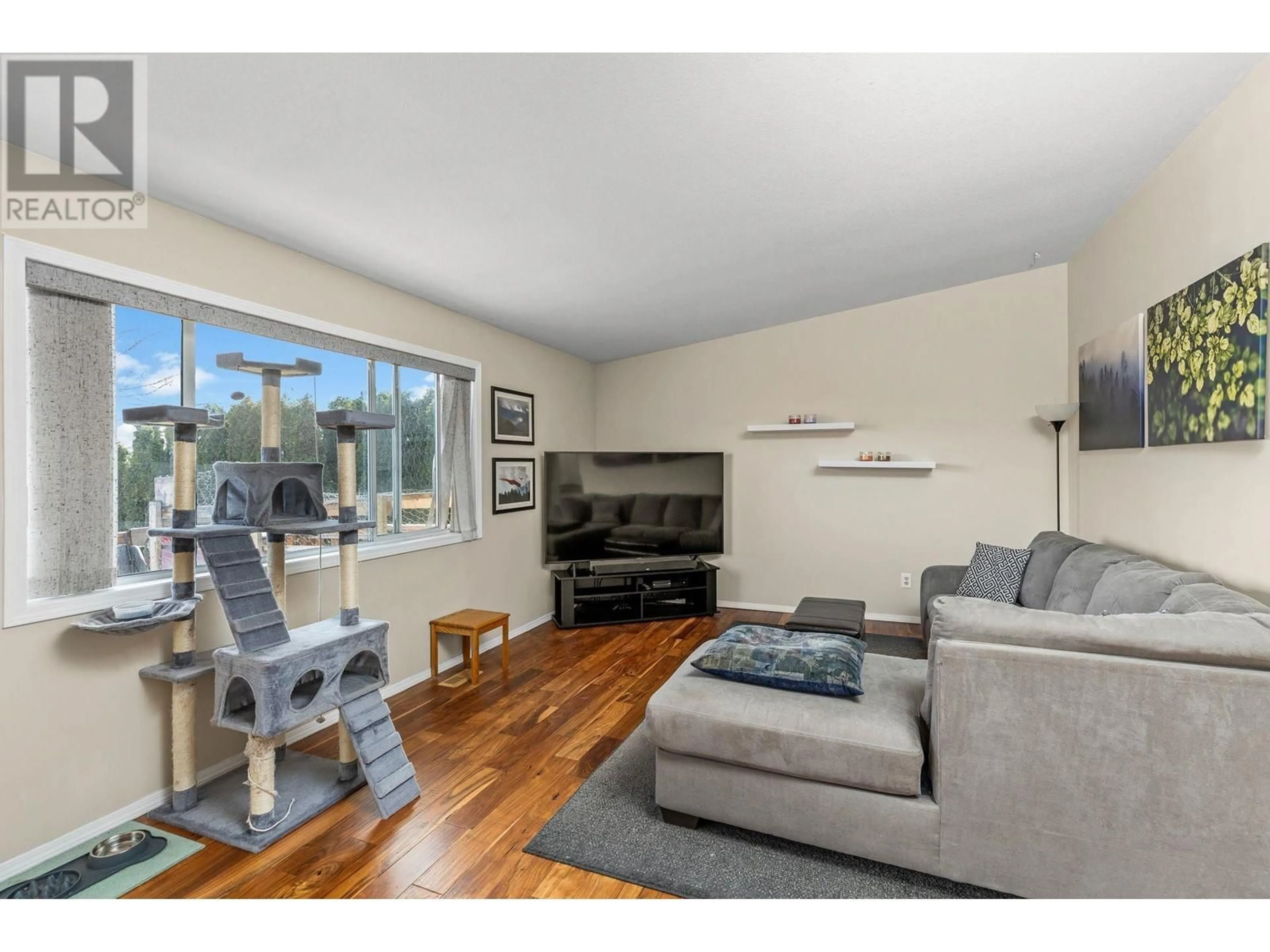 Living room with furniture, wood/laminate floor for 2125 SHAMROCK DRIVE, West Kelowna British Columbia V4T1T9