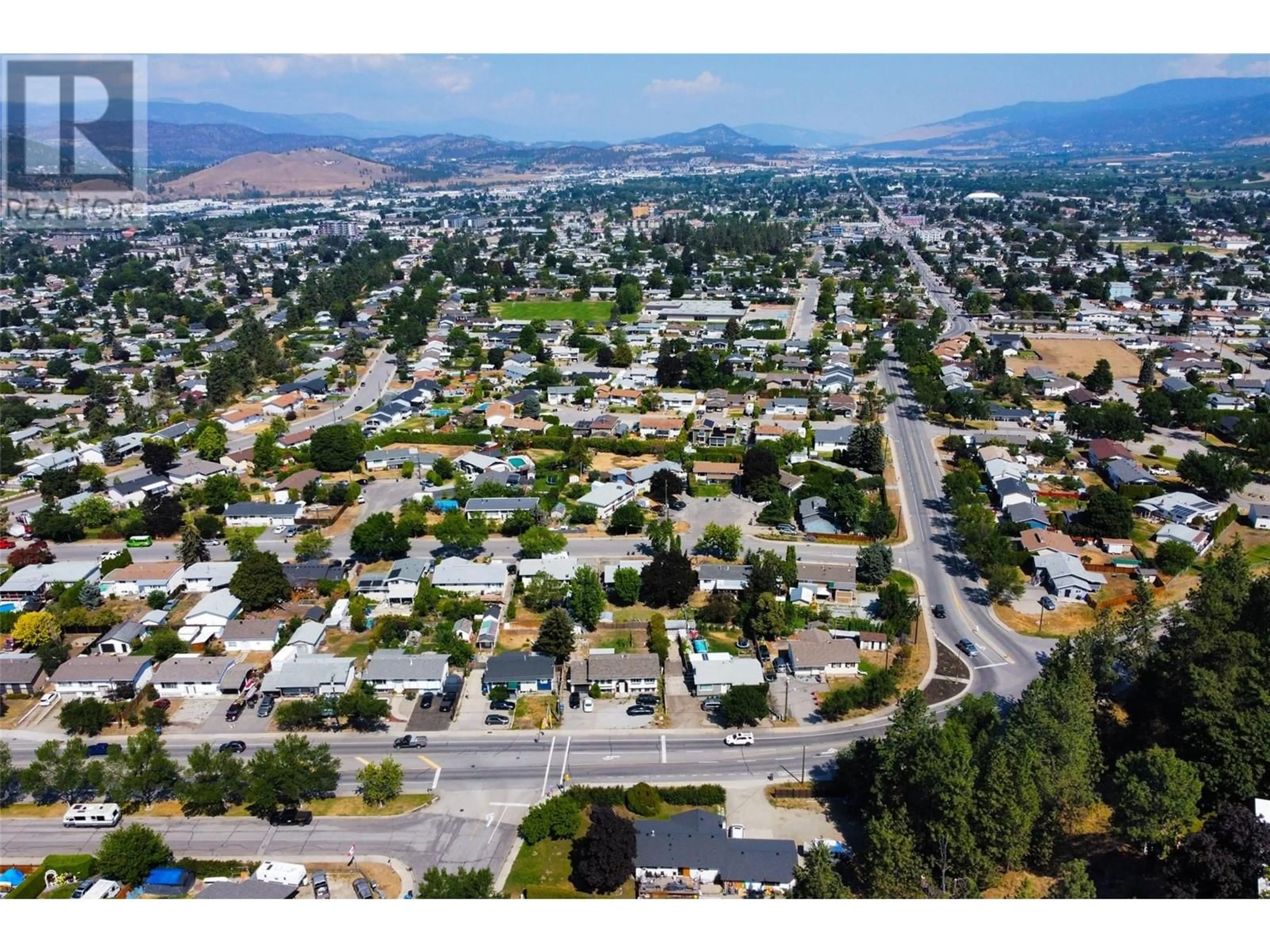 A pic from outside/outdoor area/front of a property/back of a property/a pic from drone, mountain view for 3072 SPRINGFIELD ROAD, Kelowna British Columbia V1X4M4