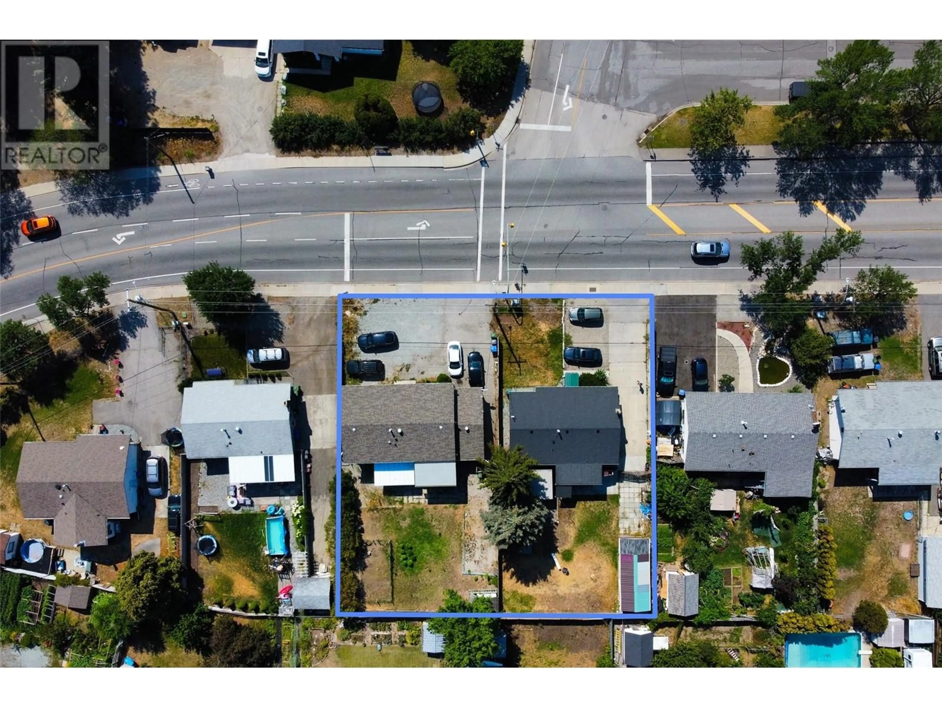 A pic from outside/outdoor area/front of a property/back of a property/a pic from drone, street for 3078 Springfield Road, Kelowna British Columbia V1X1A5