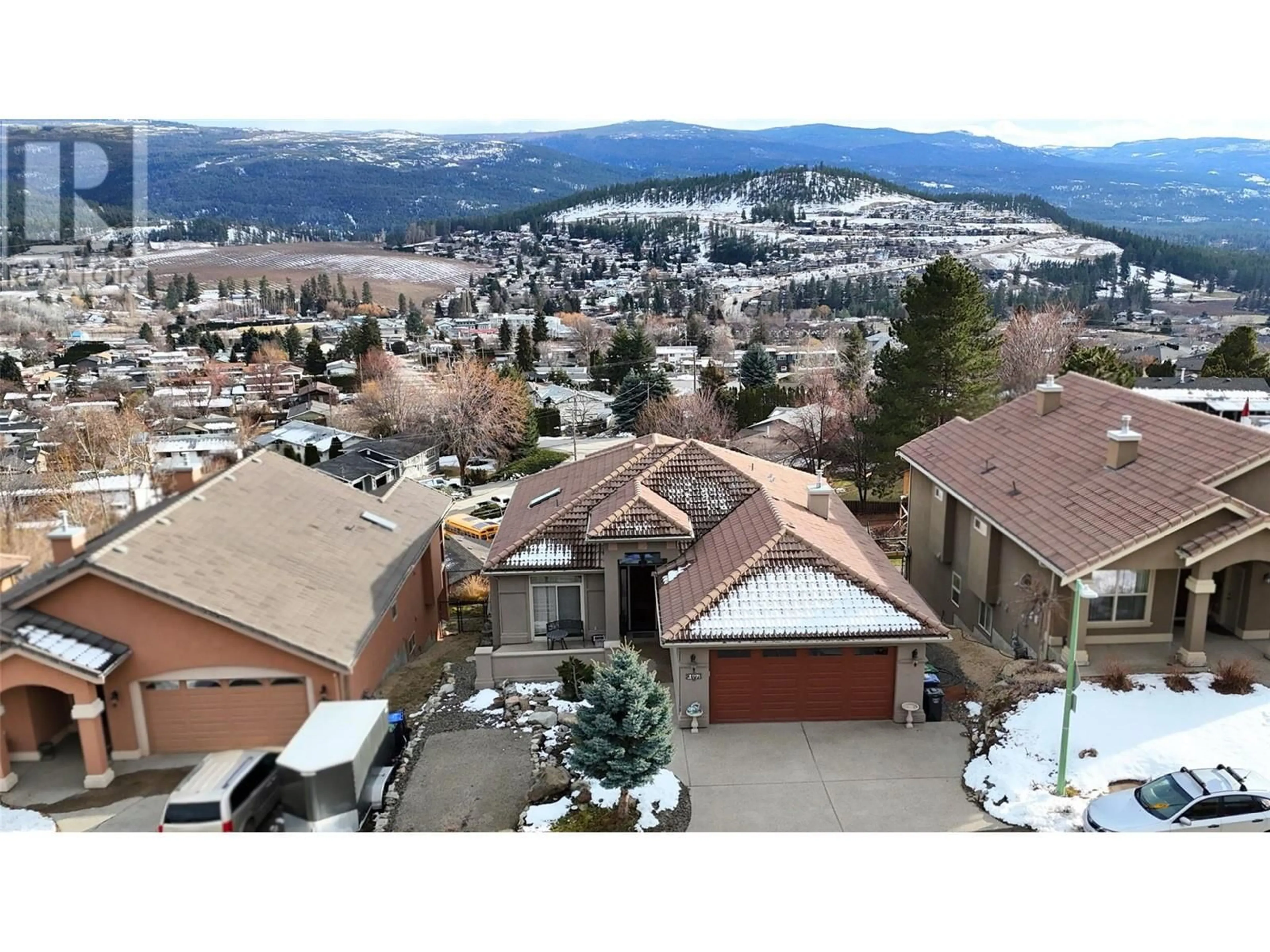 A pic from outside/outdoor area/front of a property/back of a property/a pic from drone, mountain view for 1094 Henderson Drive, Kelowna British Columbia V1P1L8