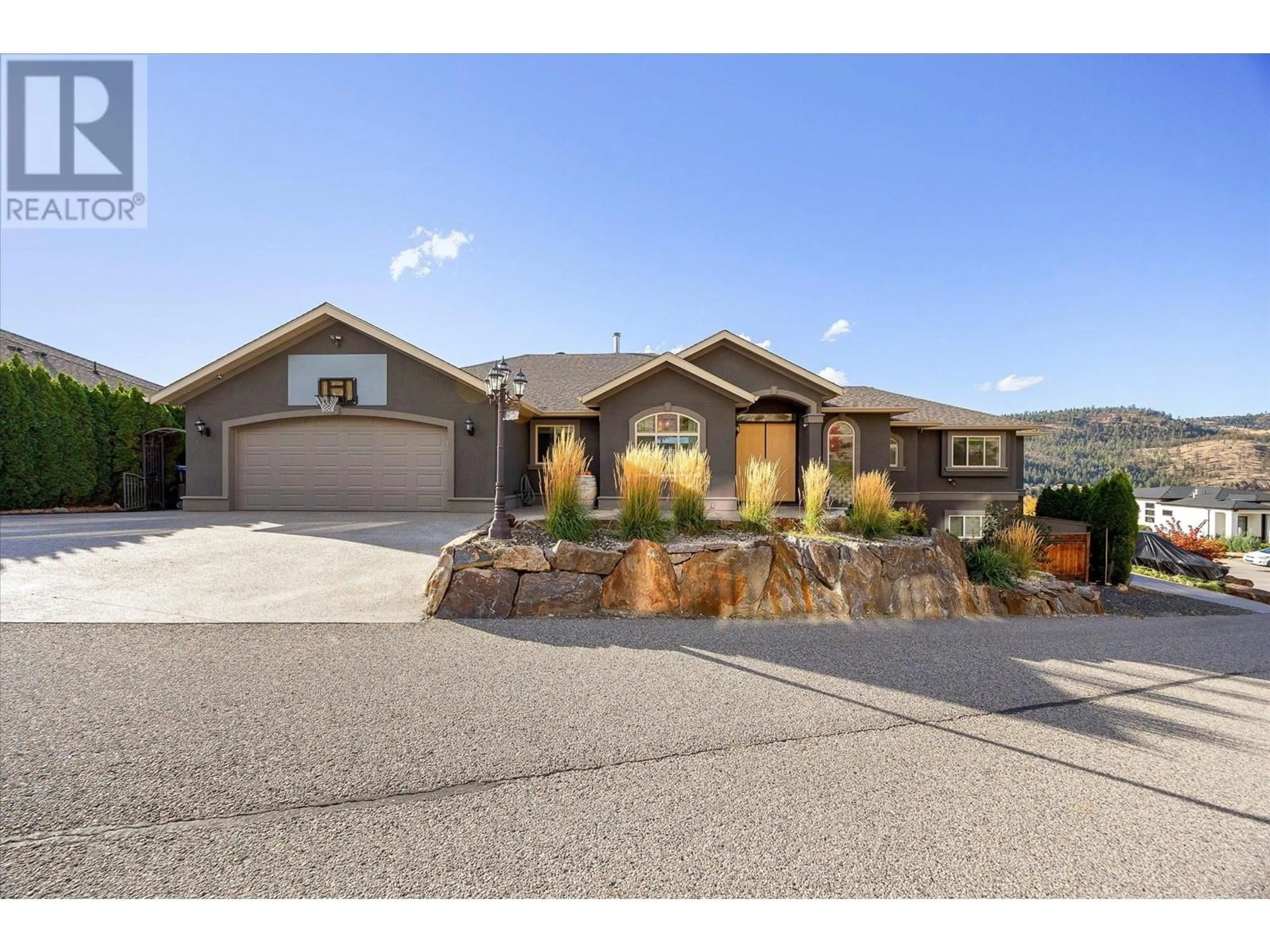 Home with brick exterior material, street for 619 DENALI COURT, Kelowna British Columbia V1V2P6