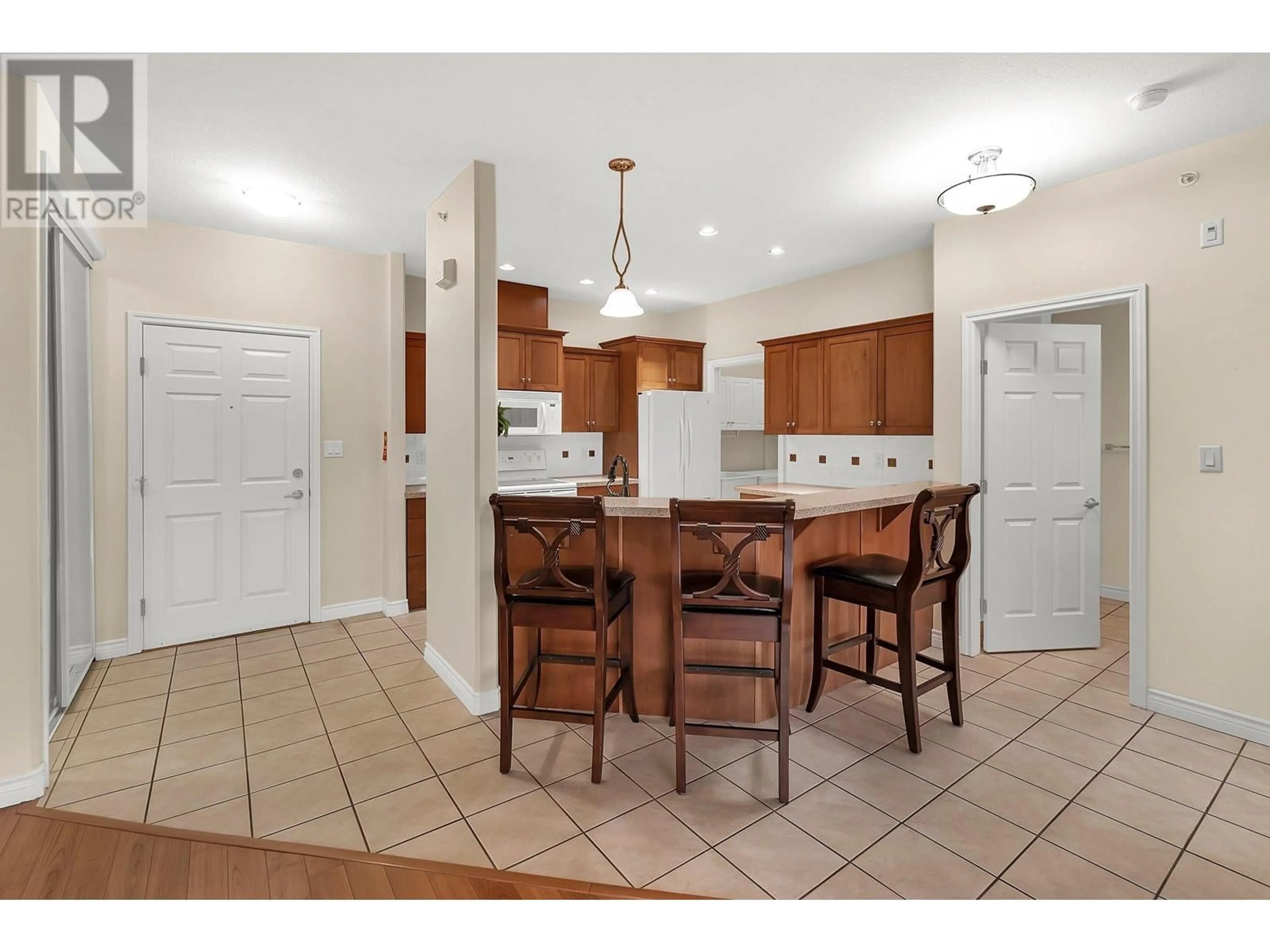 Open concept kitchen, ceramic/tile floor for 415 - 1961 DURNIN ROAD, Kelowna British Columbia V1X7Z6