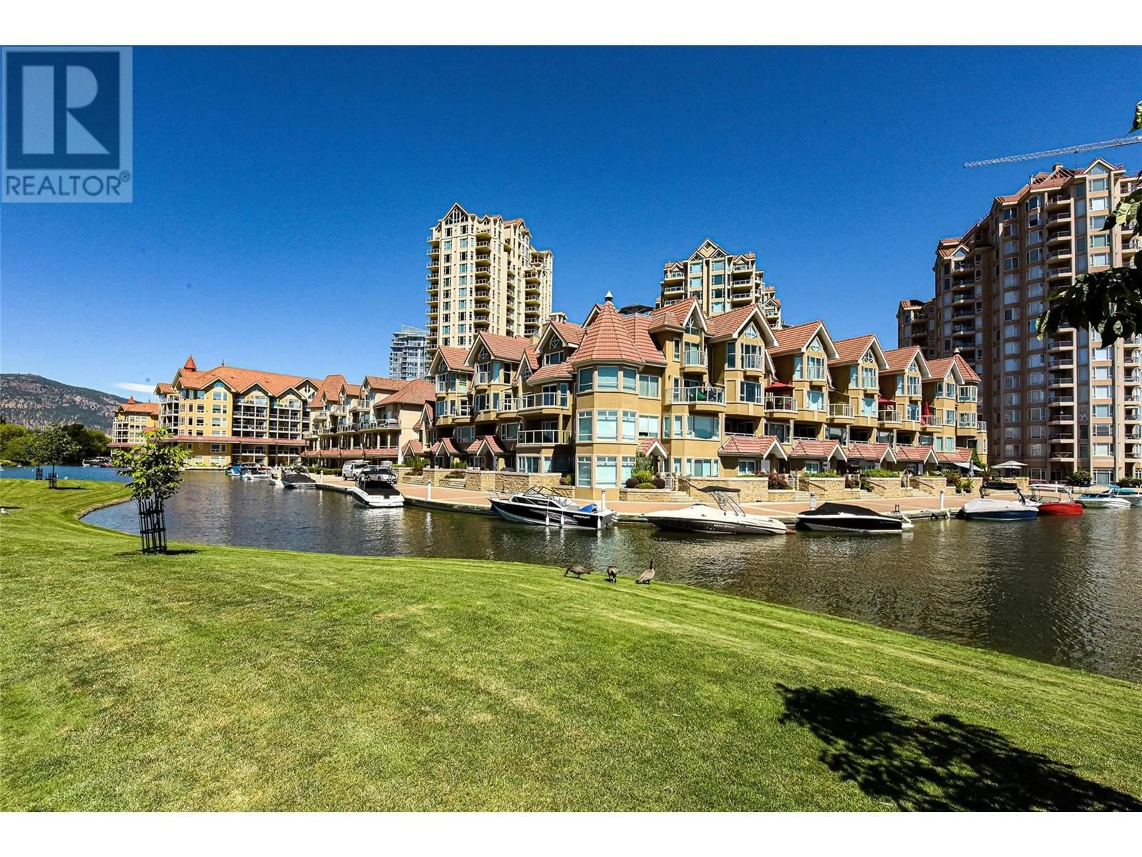 A pic from outside/outdoor area/front of a property/back of a property/a pic from drone, water/lake/river/ocean view for 1152 Sunset Drive Unit# 606, Kelowna British Columbia V1Y9R7