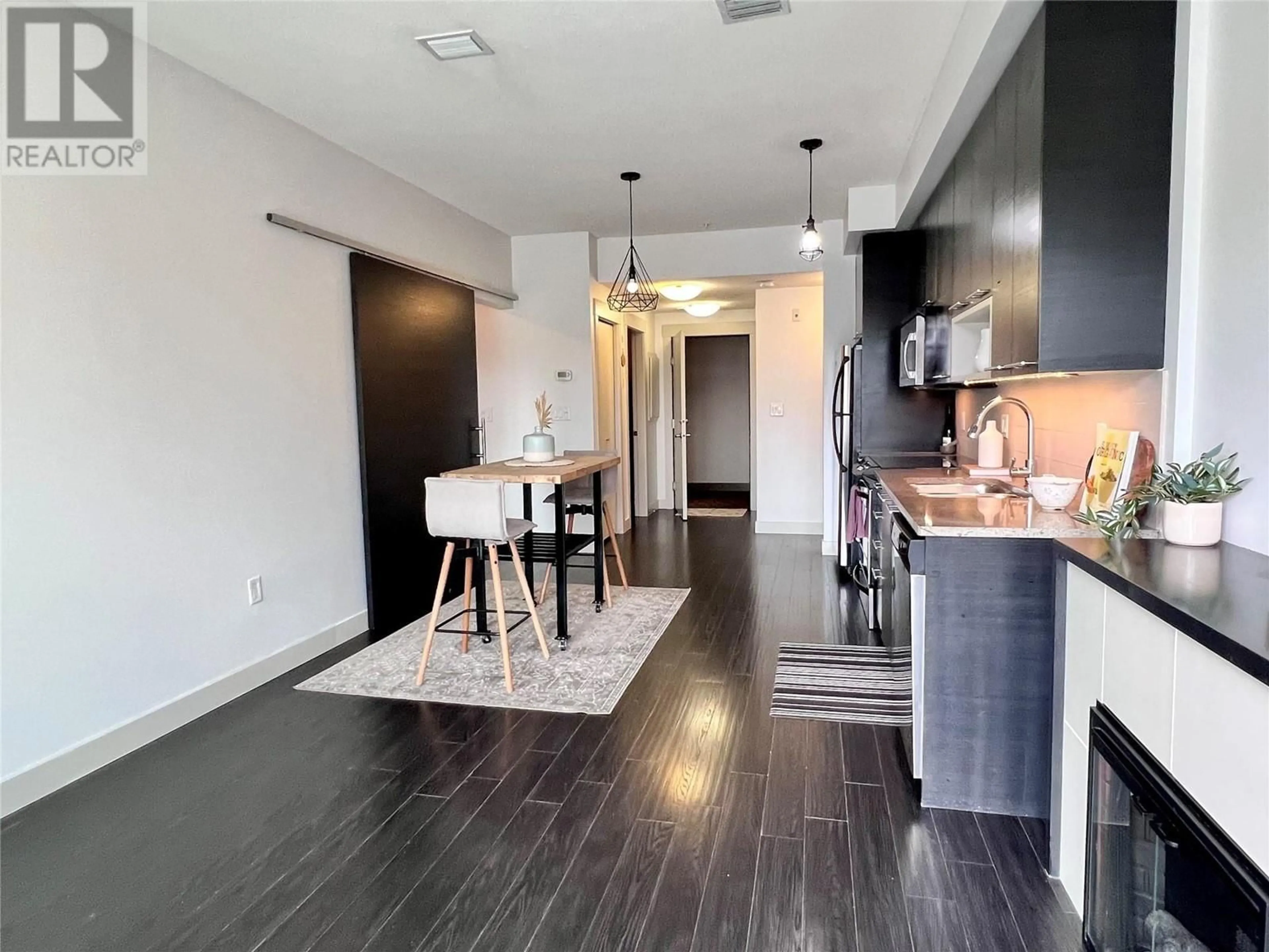 Open concept kitchen, wood/laminate floor for 1210 - 1000 TALASA WAY, Kamloops British Columbia V2H1R1