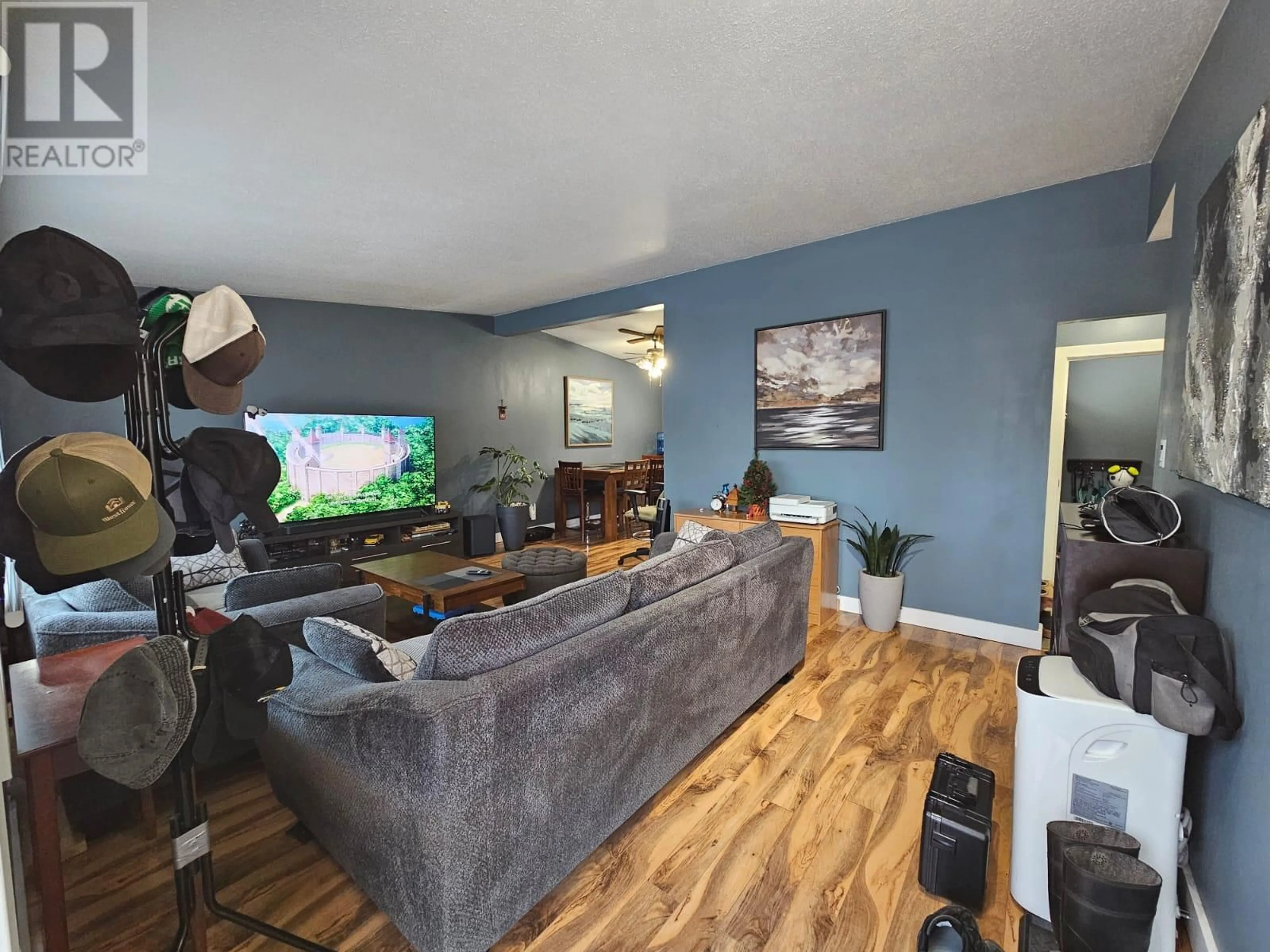 Living room with furniture, wood/laminate floor for 4529 49 Avenue, Chetwynd British Columbia V0C1J0