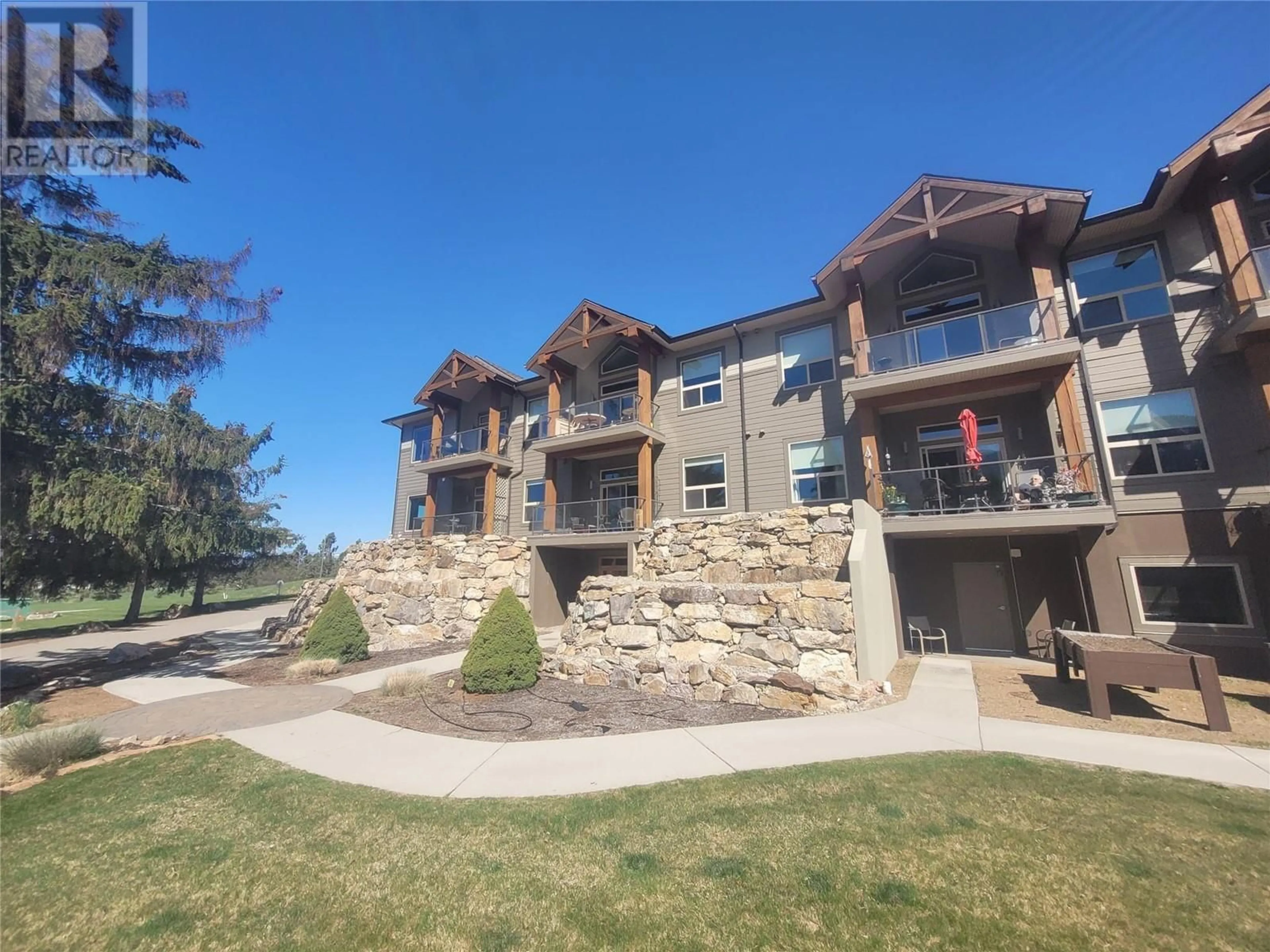 A pic from outside/outdoor area/front of a property/back of a property/a pic from drone, building for 9100 Mackie Drive Unit# 104, Coldstream British Columbia V1B1G9