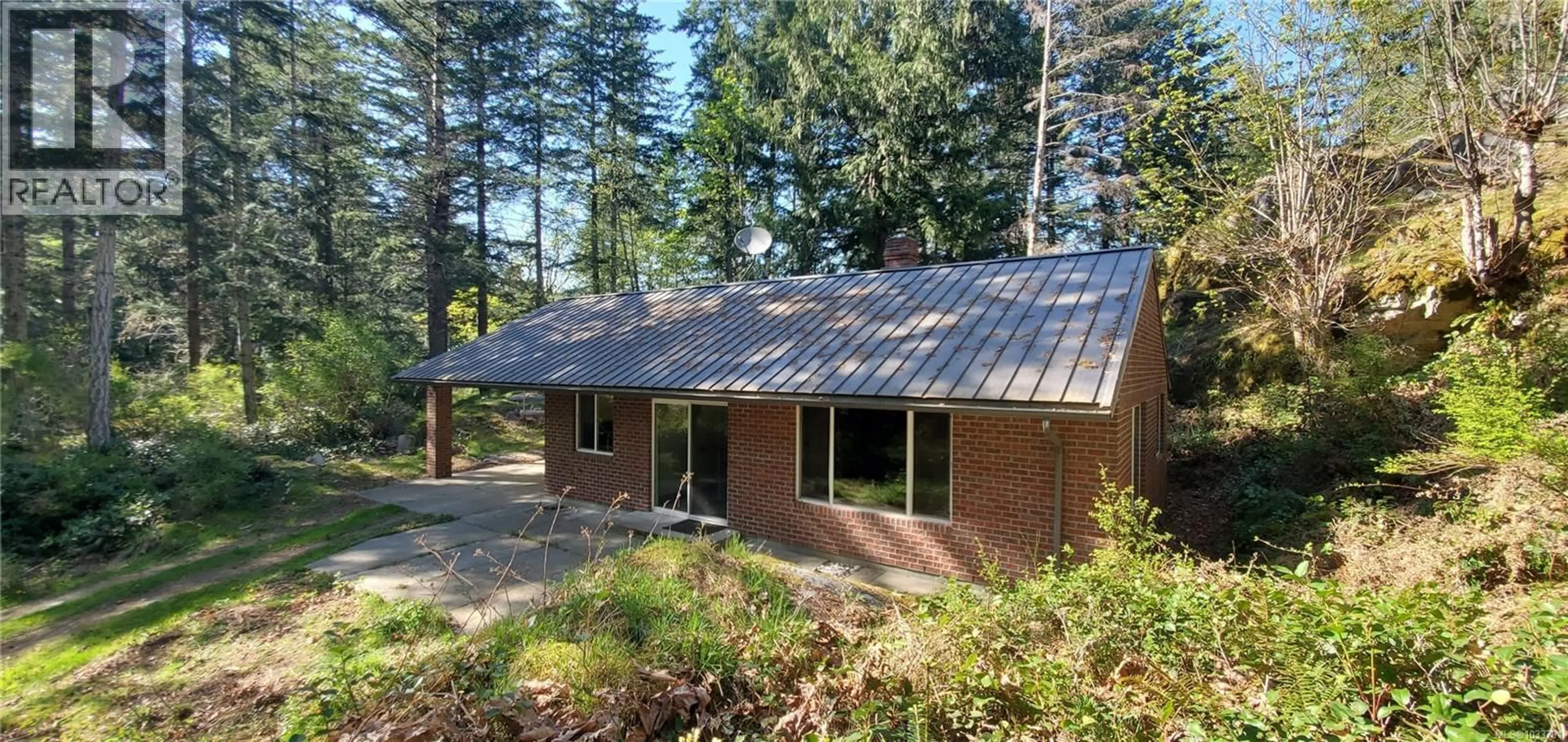 Home with brick exterior material, unknown for 226 BOLD POINT ROAD, Quadra Island British Columbia V0P1H0