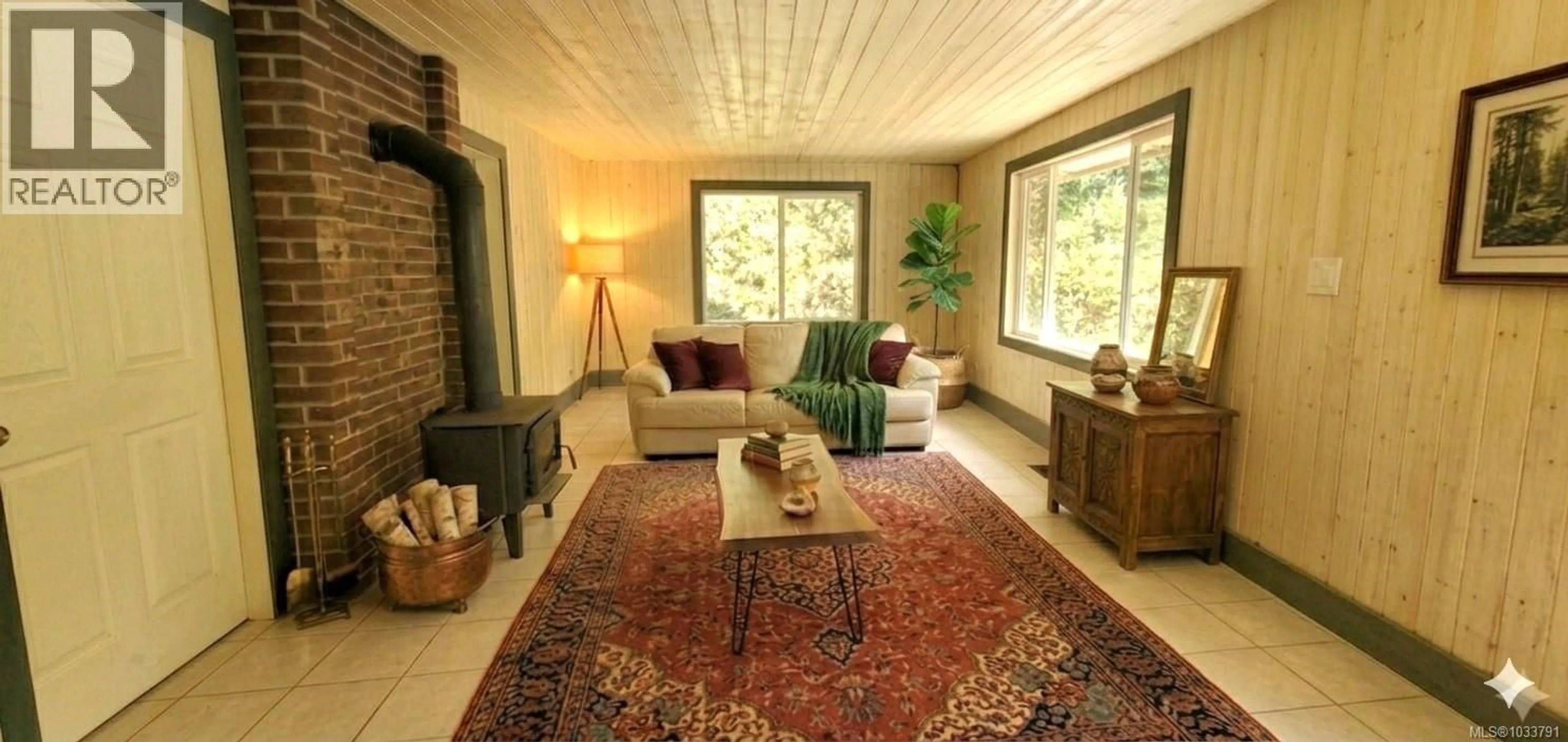 Living room with furniture, carpet floor for 226 BOLD POINT ROAD, Quadra Island British Columbia V0P1H0