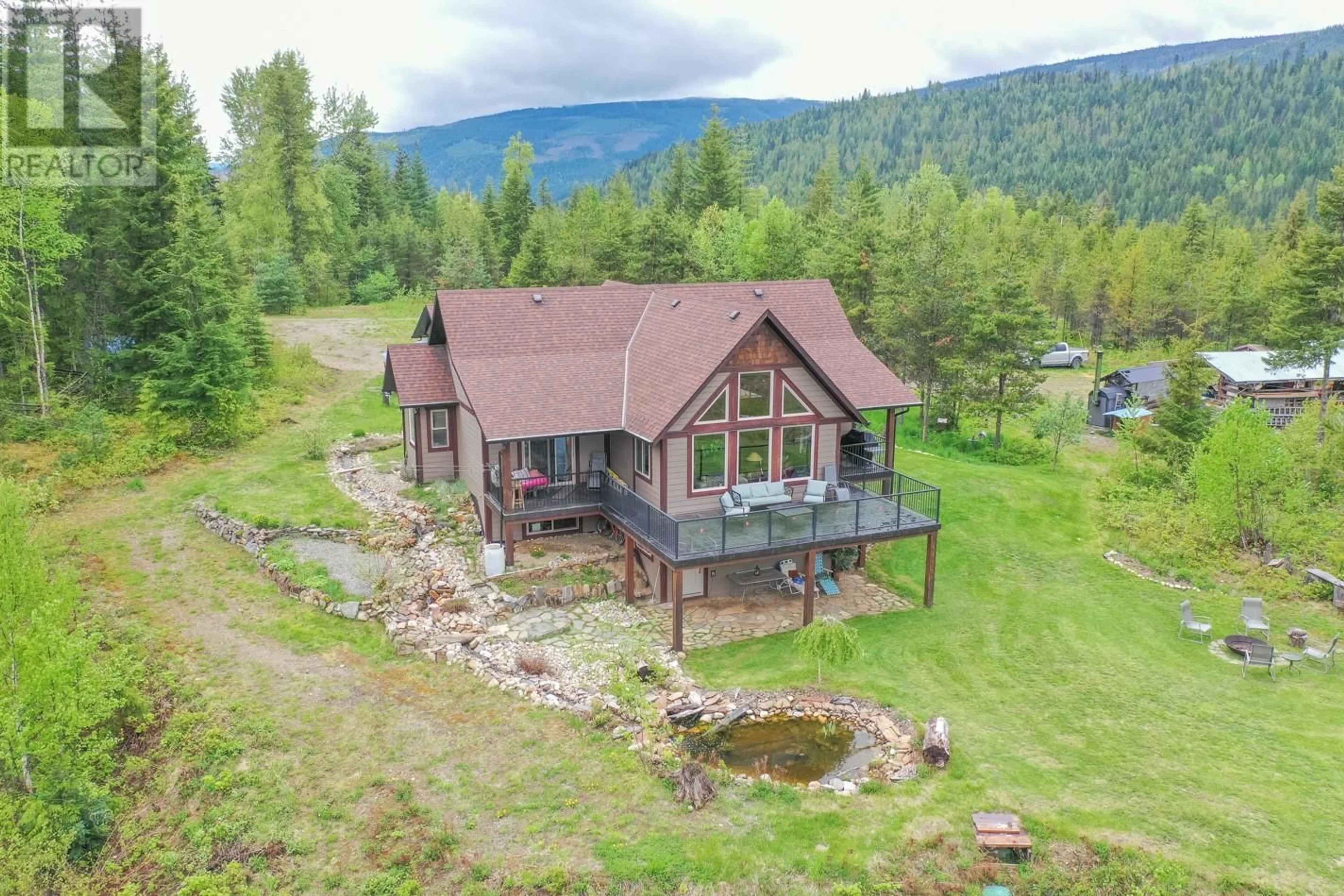 A pic from outside/outdoor area/front of a property/back of a property/a pic from drone, mountain view for 1433 SUGAR LAKE ROAD, Cherryville British Columbia V0E2G2