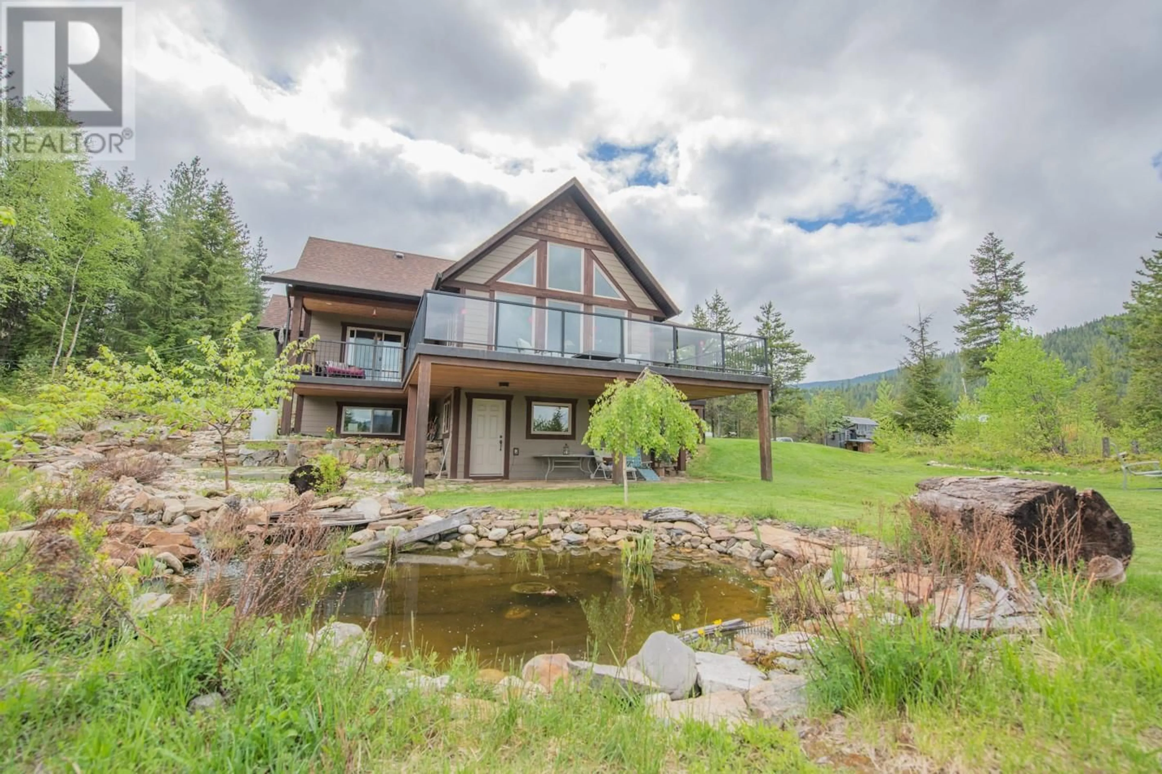 A pic from outside/outdoor area/front of a property/back of a property/a pic from drone, water/lake/river/ocean view for 1433 SUGAR LAKE ROAD, Cherryville British Columbia V0E2G2