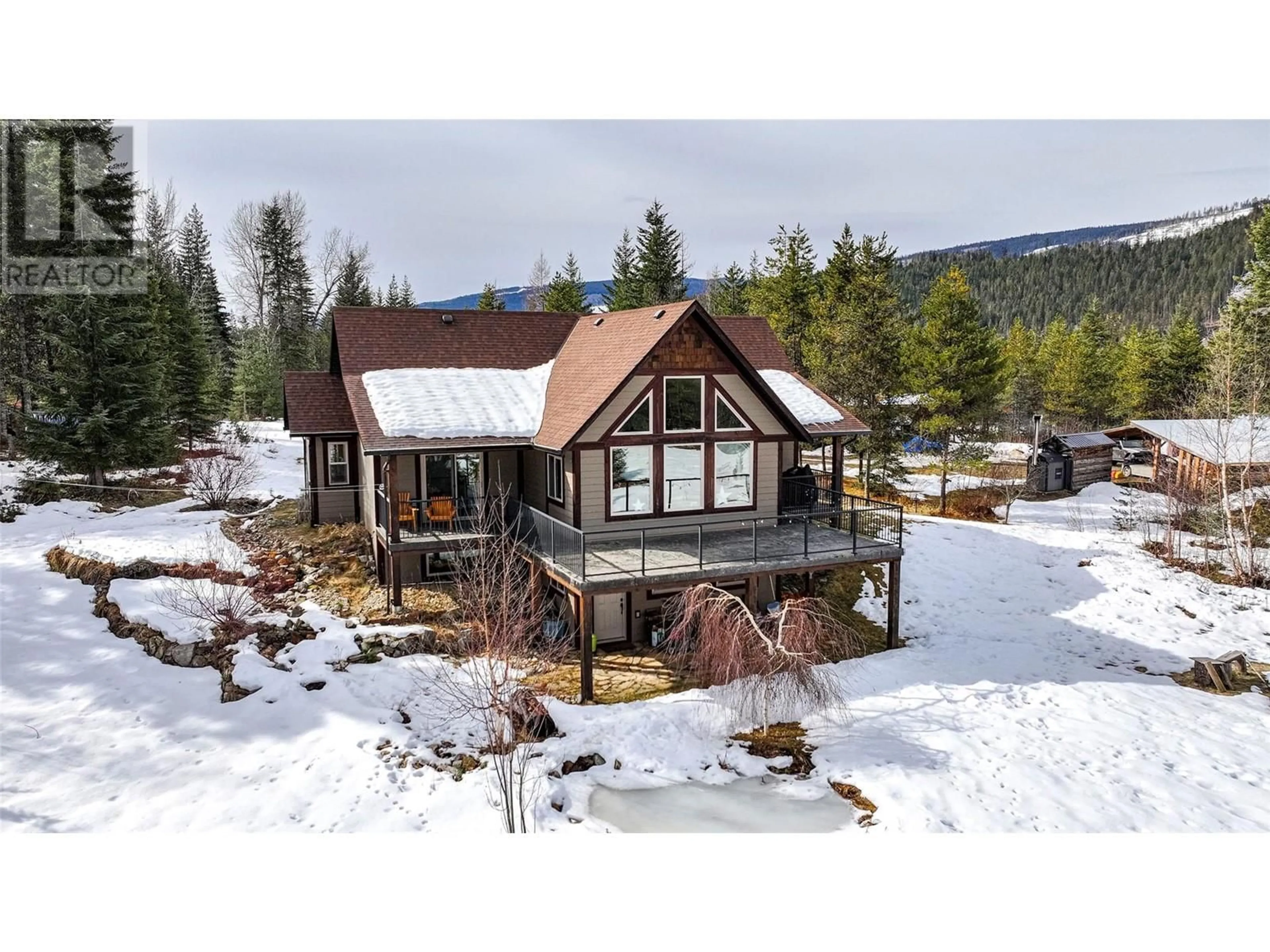 A pic from outside/outdoor area/front of a property/back of a property/a pic from drone, mountain view for 1433 SUGAR LAKE ROAD, Cherryville British Columbia V0E2G2