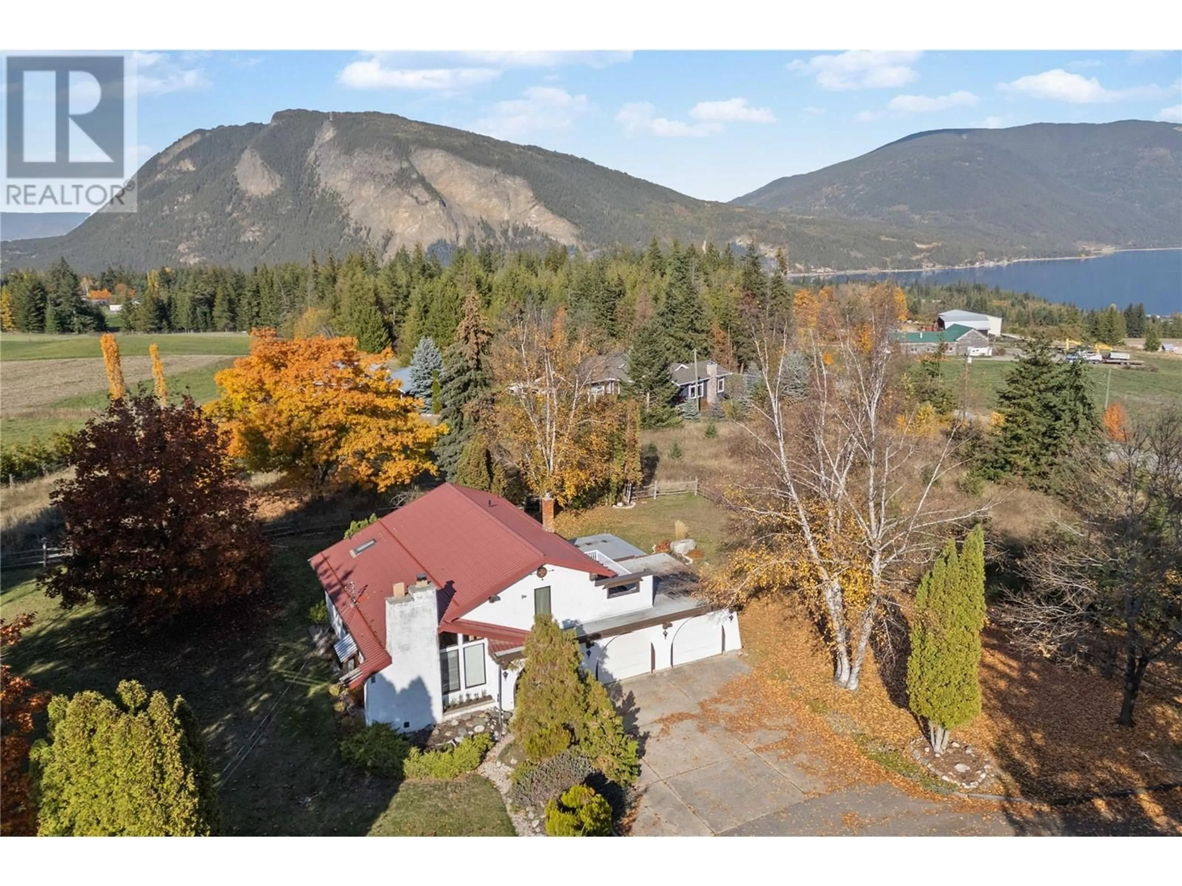 A pic from outside/outdoor area/front of a property/back of a property/a pic from drone, mountain view for 5261 35 Street NE, Salmon Arm British Columbia V1E2B3