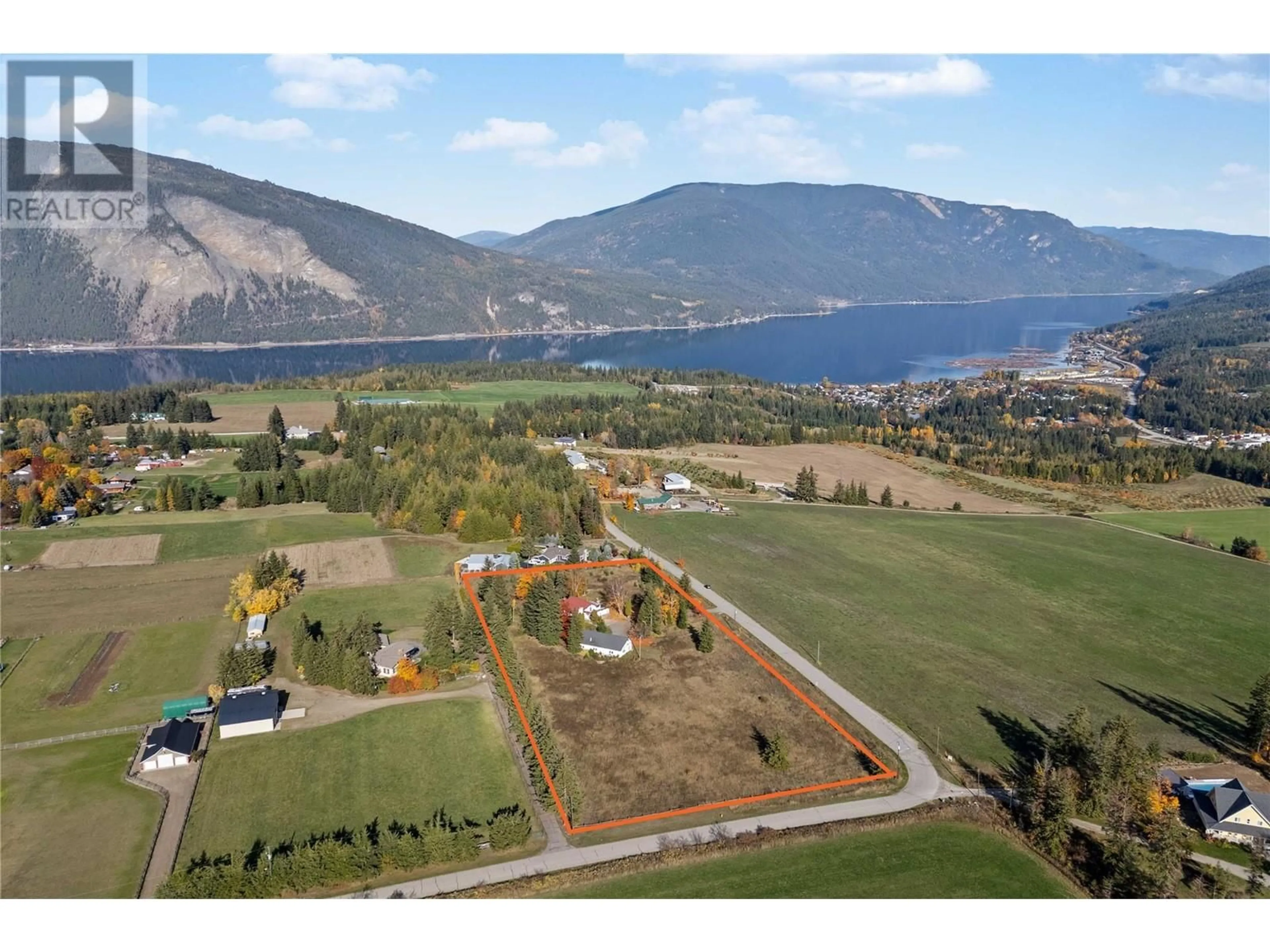 A pic from outside/outdoor area/front of a property/back of a property/a pic from drone, water/lake/river/ocean view for 5261 35 Street NE, Salmon Arm British Columbia V1E2B3