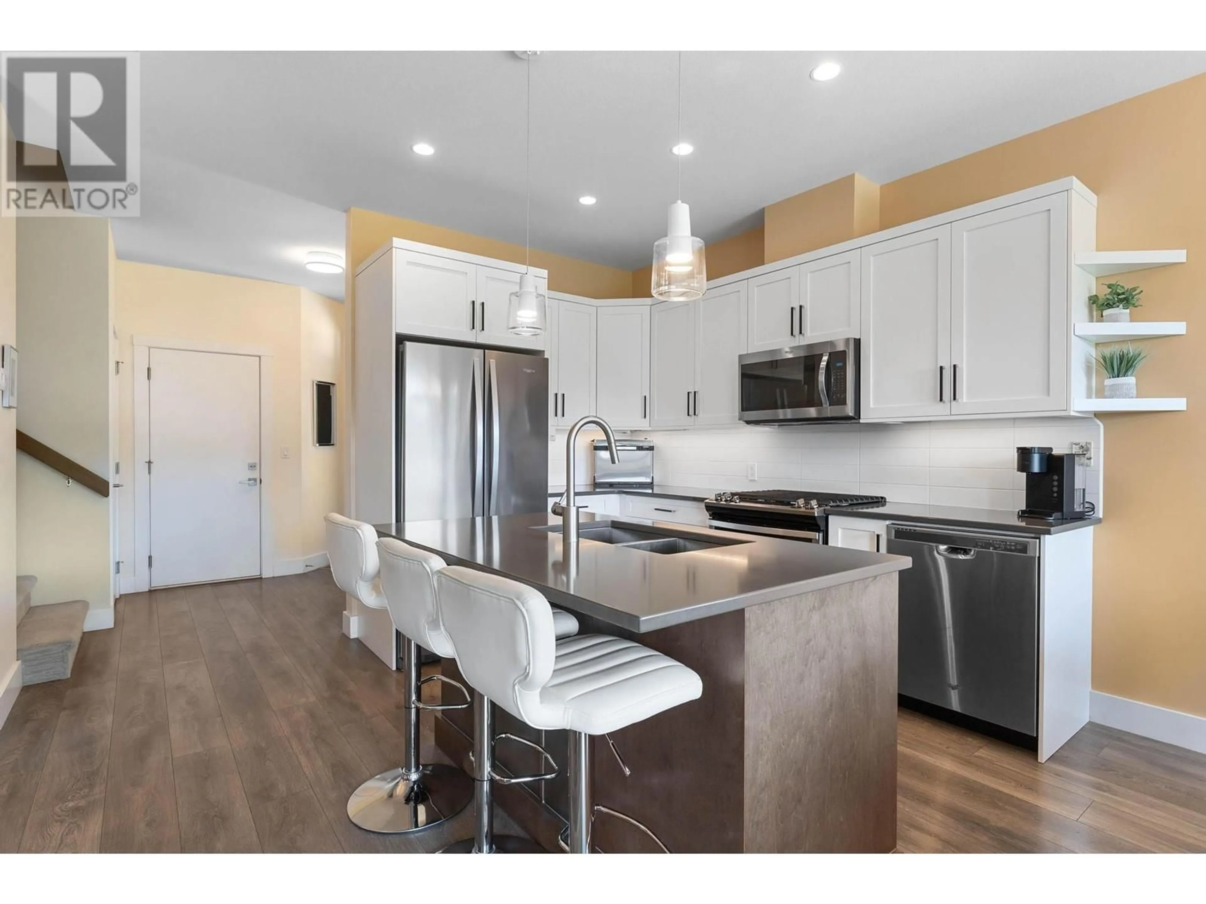 Open concept kitchen, wood/laminate floor for 2331 Tallus Ridge Drive Unit# 3, West Kelowna British Columbia V4T1V6