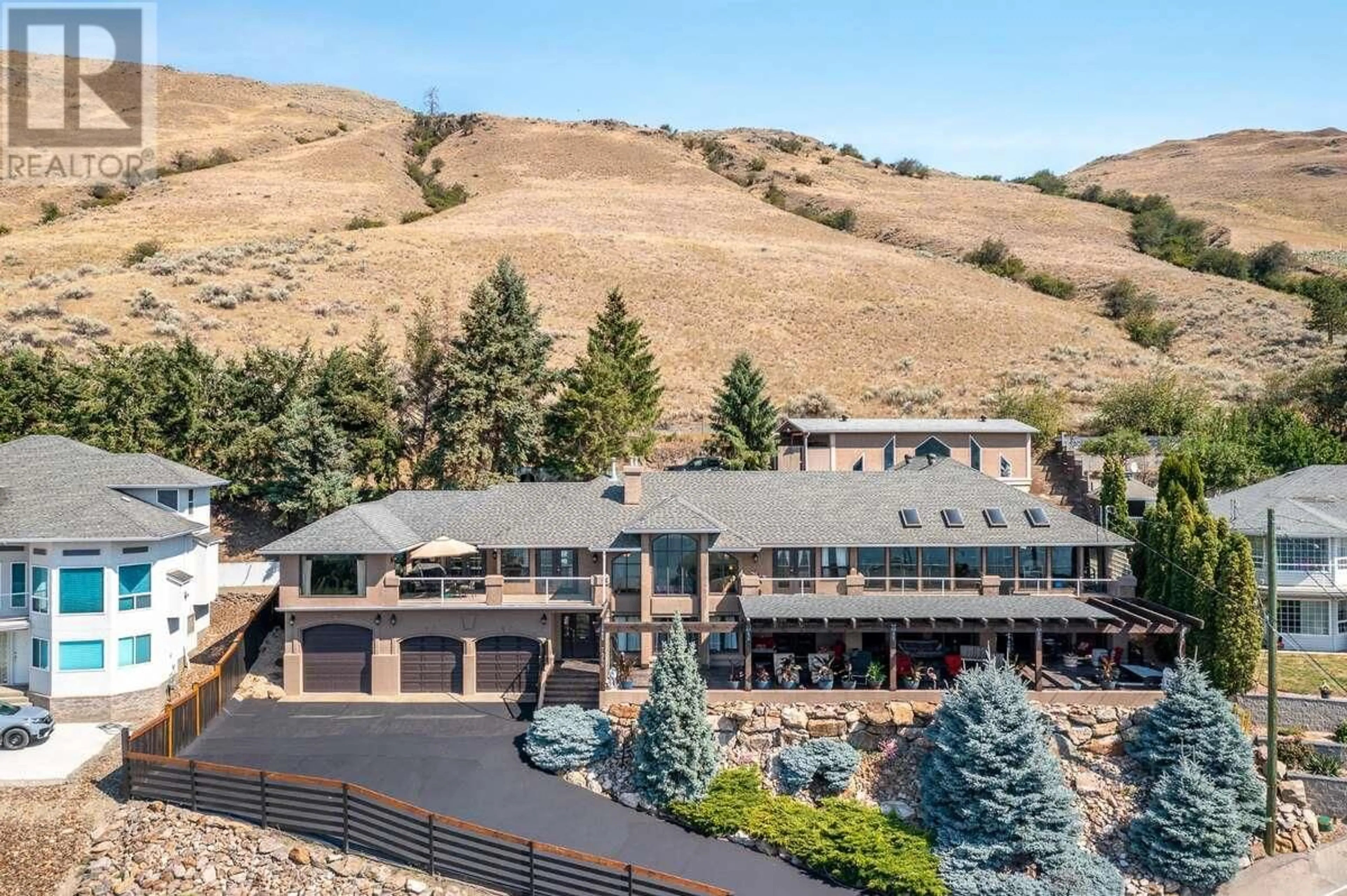 A pic from outside/outdoor area/front of a property/back of a property/a pic from drone, mountain view for 7959 TRONSON ROAD, Vernon British Columbia V1T6L7