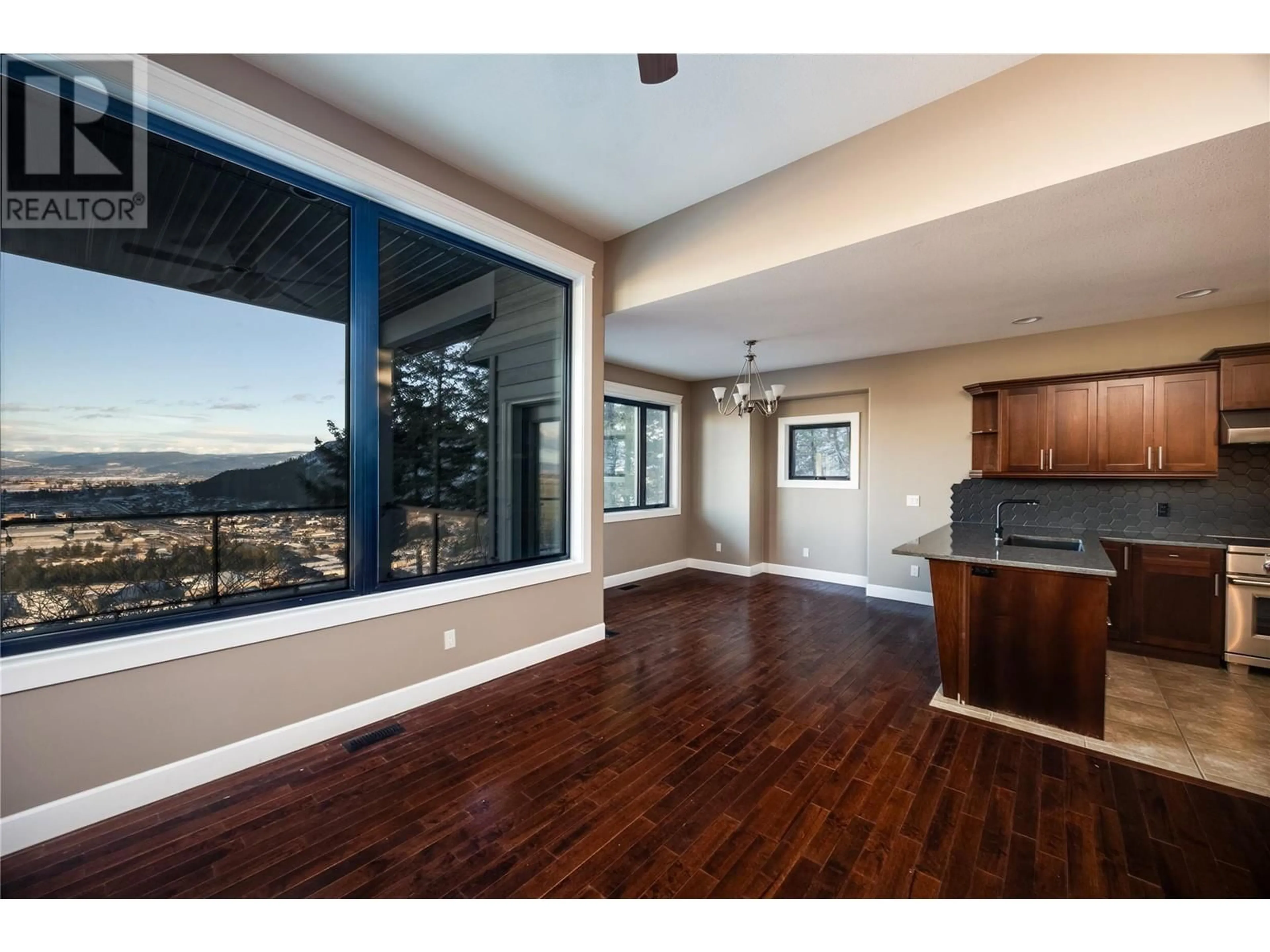 Open concept kitchen, wood/laminate floor for 2039 Cornerstone Drive, West Kelowna British Columbia V4T2Y3