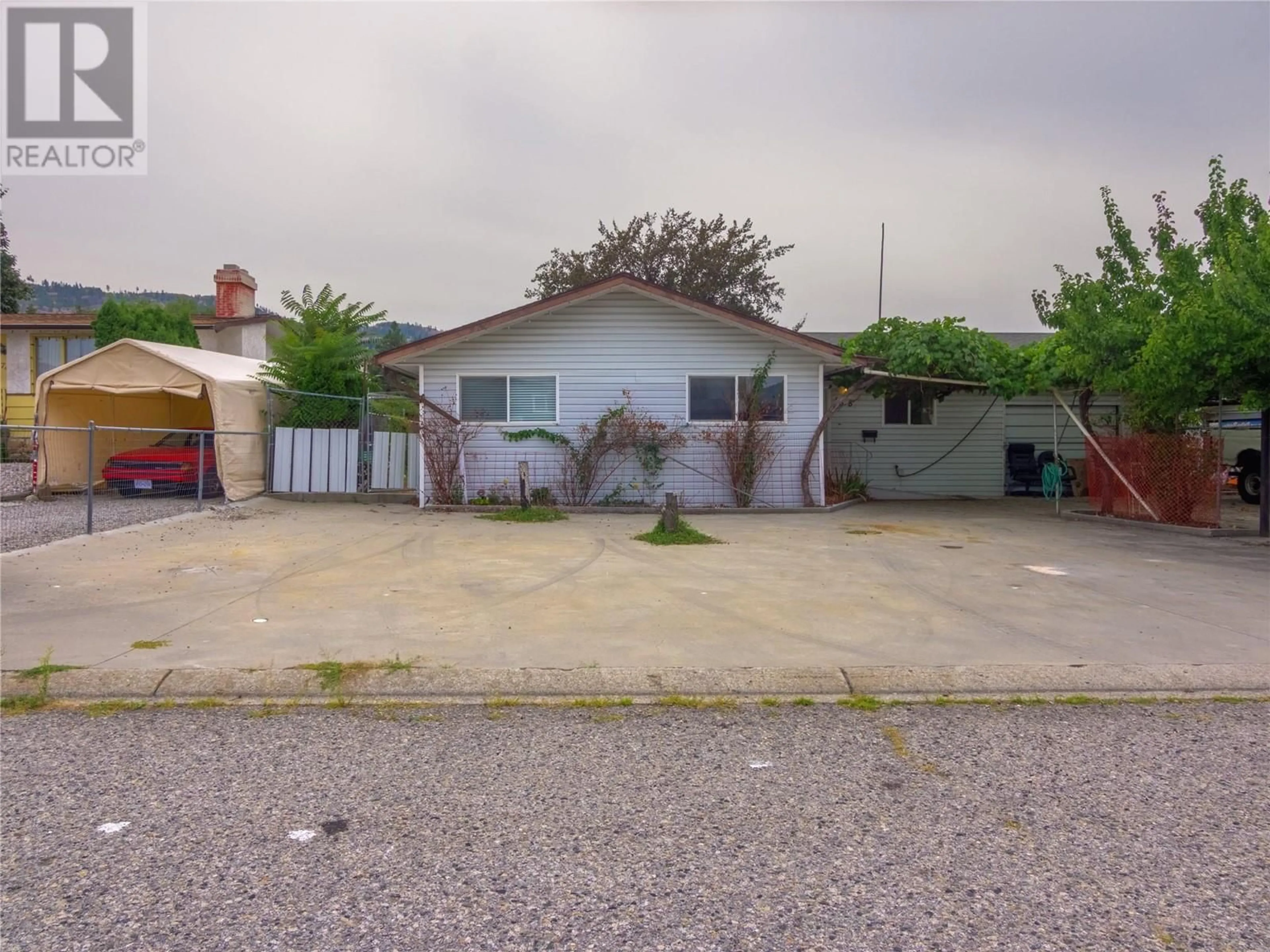 A pic from outside/outdoor area/front of a property/back of a property/a pic from drone, street for 168 Braelyn Crescent, Penticton British Columbia V2A6V3