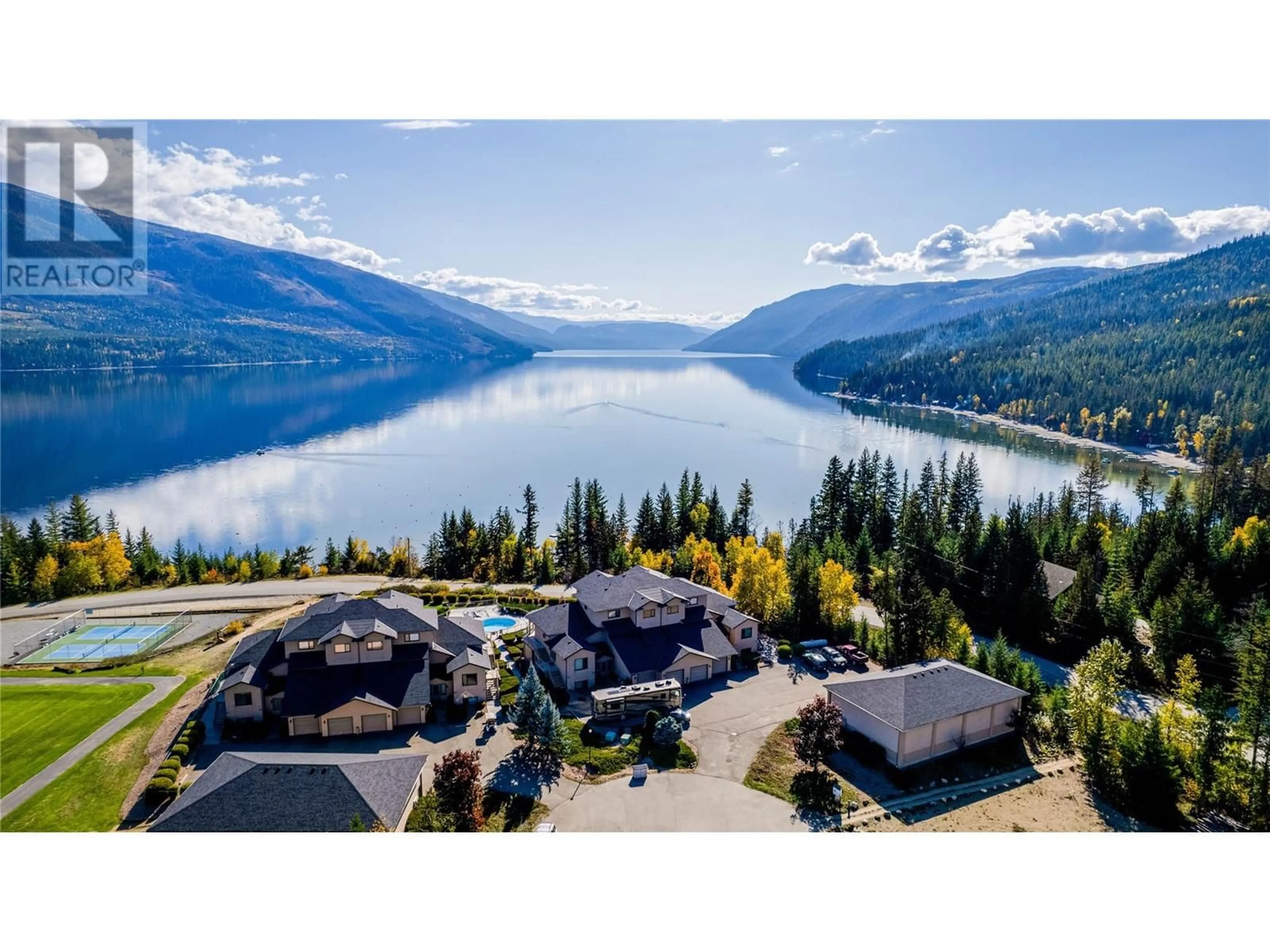 A pic from outside/outdoor area/front of a property/back of a property/a pic from drone, water/lake/river/ocean view for 3473 Lakeview Place Unit# 203, Enderby British Columbia V0E1V5