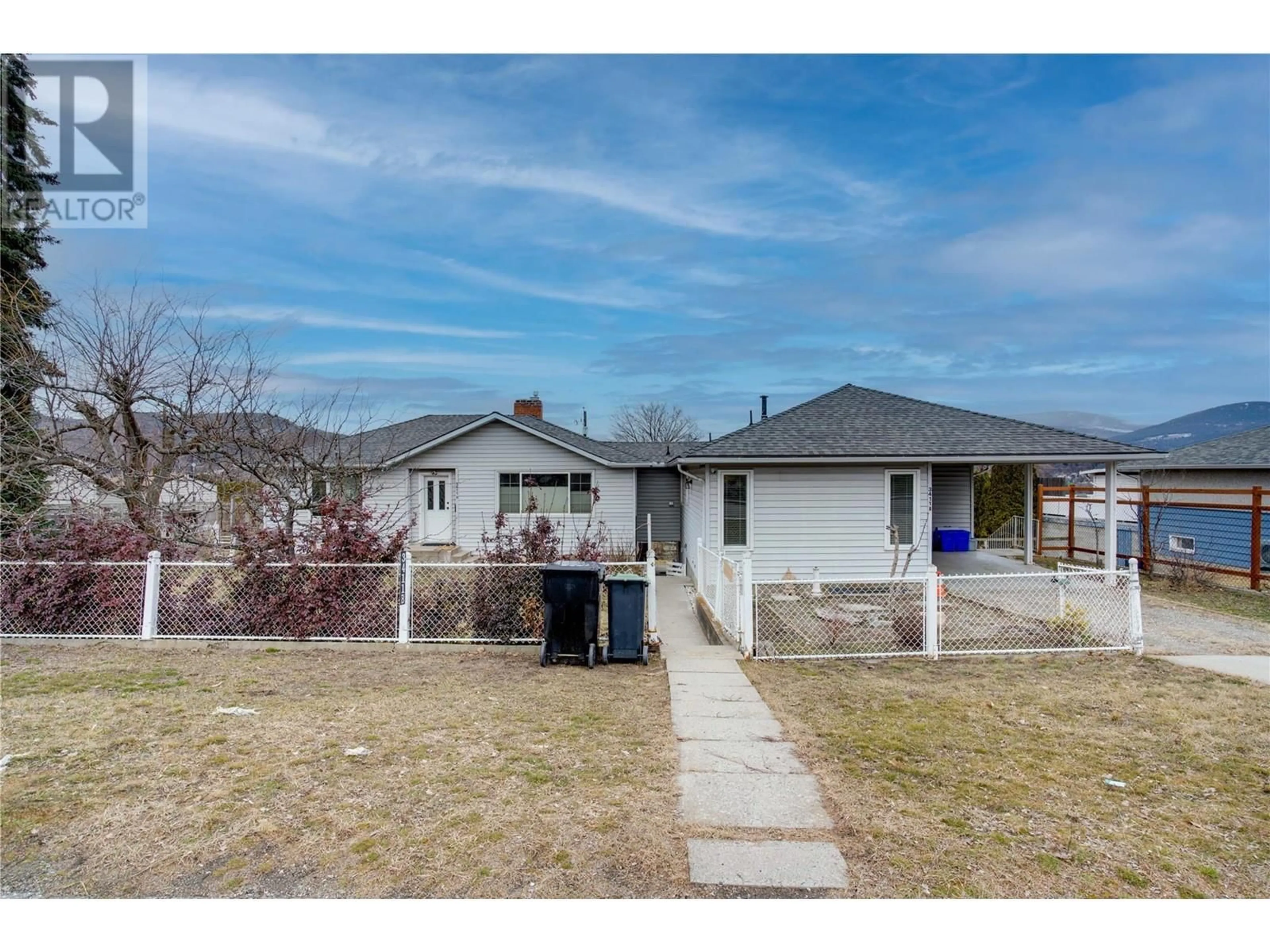 A pic from outside/outdoor area/front of a property/back of a property/a pic from drone, street for 3411 18 Avenue Unit# A&B, Vernon British Columbia V1T1E2