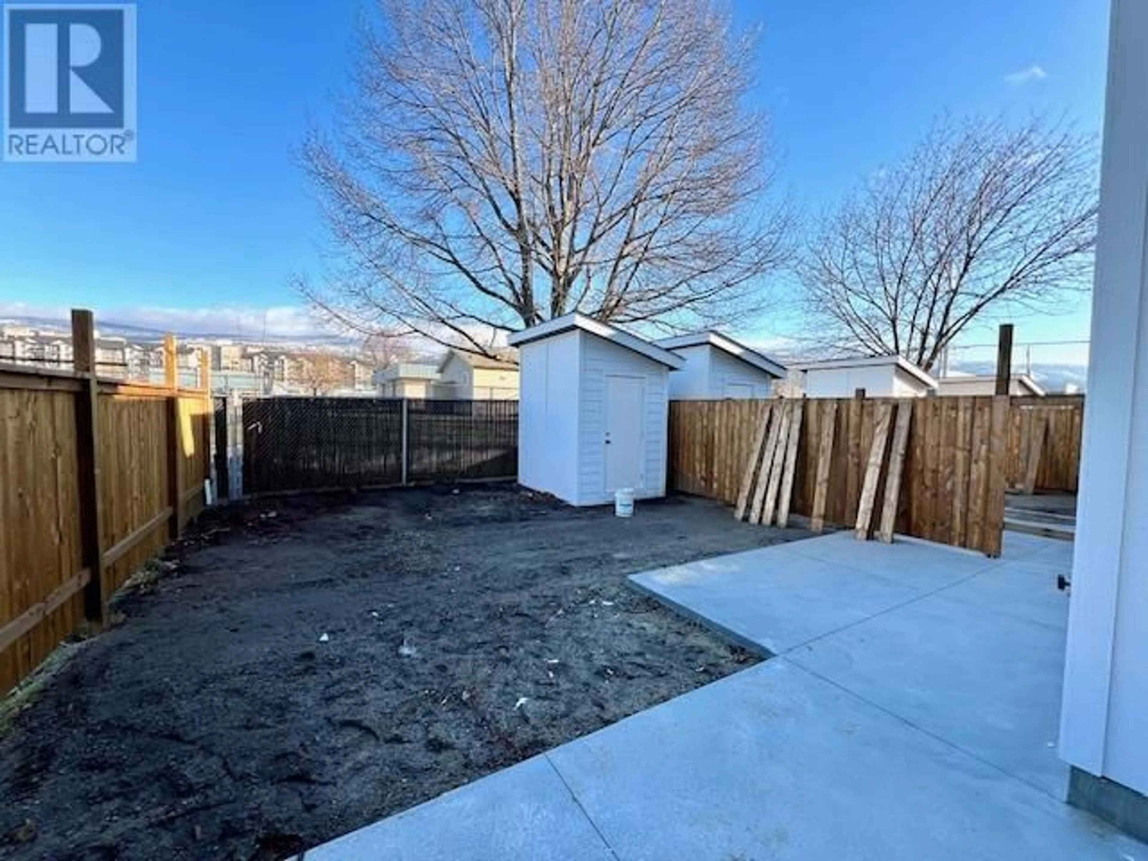 A pic from outside/outdoor area/front of a property/back of a property/a pic from drone, street for 275 Kinney Avenue Unit# 104, Penticton British Columbia V2A3P3