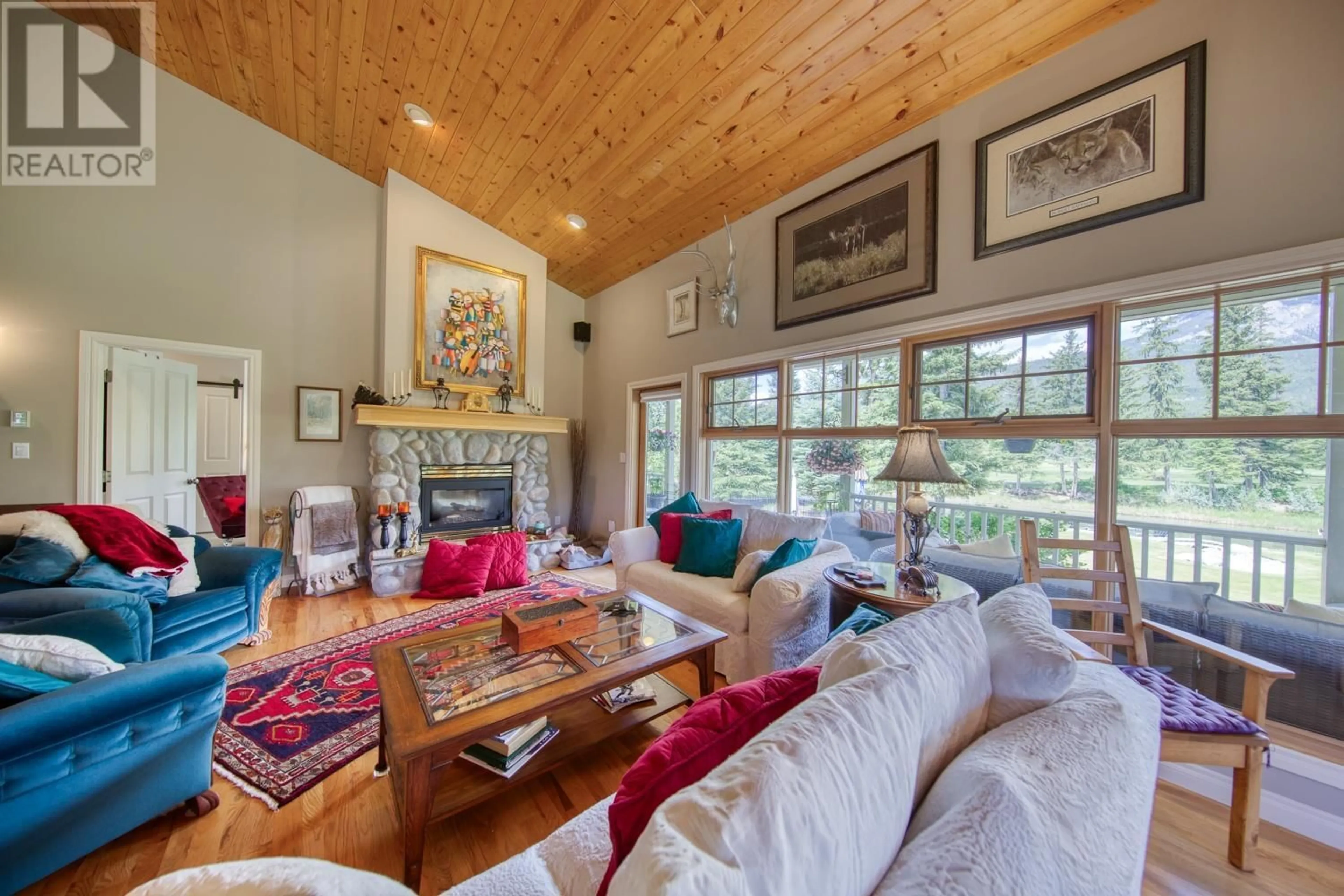 Living room with furniture, wood/laminate floor for 5090 RIVERSIDE Drive, Fairmont Hot Springs British Columbia V0B1L1