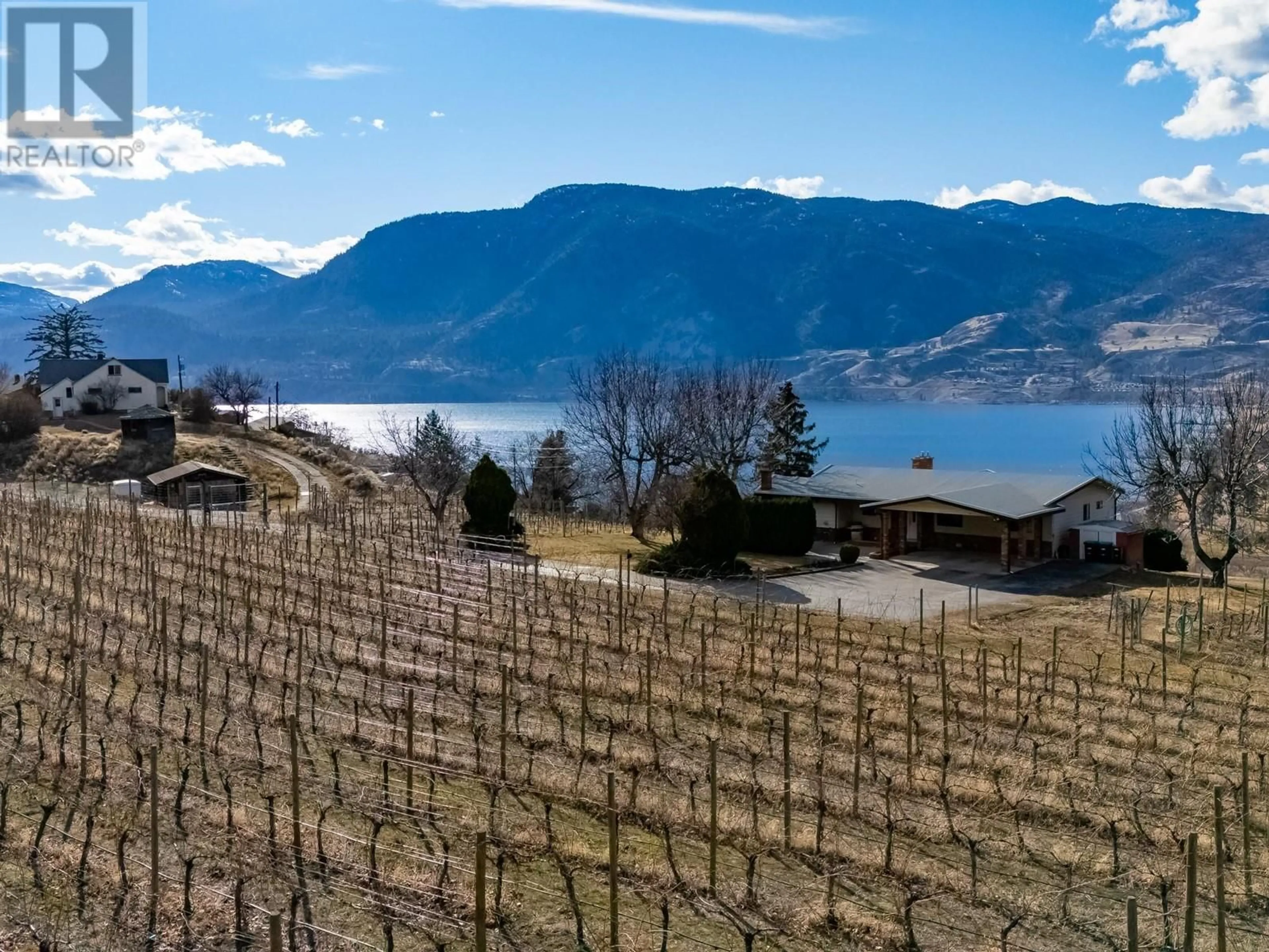 A pic from outside/outdoor area/front of a property/back of a property/a pic from drone, mountain view for 105 Spruce Road, Penticton British Columbia V2A8V9