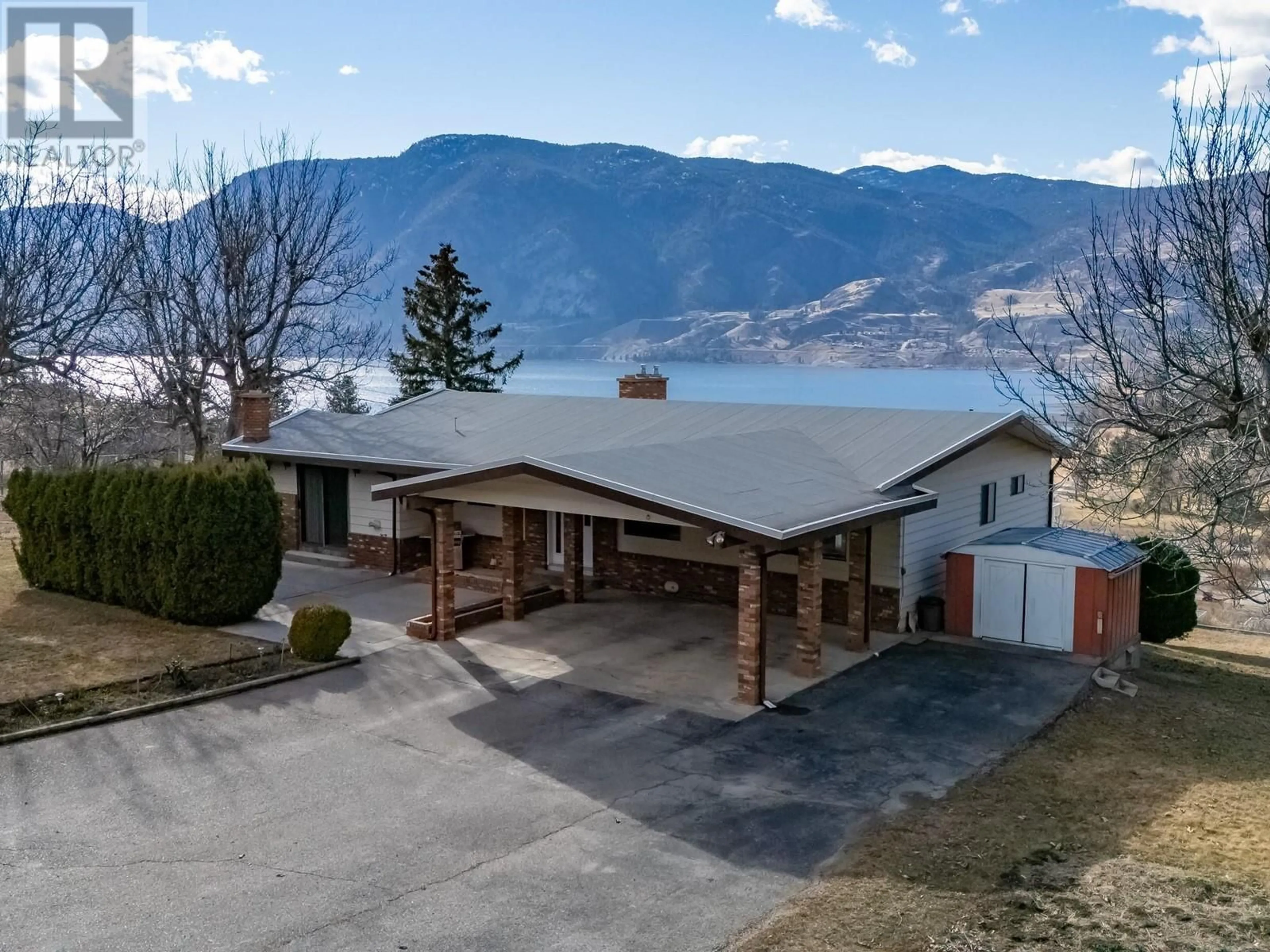 A pic from outside/outdoor area/front of a property/back of a property/a pic from drone, mountain view for 105 Spruce Road, Penticton British Columbia V2A8V9