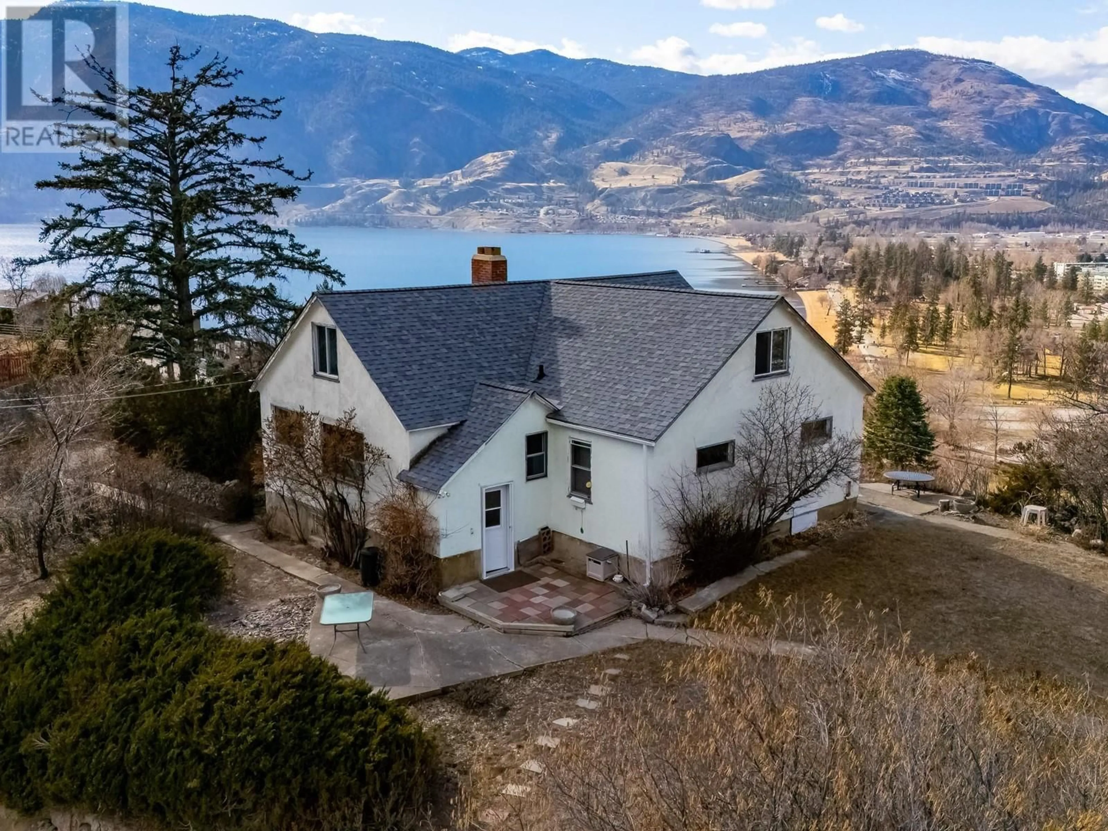 A pic from outside/outdoor area/front of a property/back of a property/a pic from drone, water/lake/river/ocean view for 105 Spruce Road, Penticton British Columbia V2A8V9