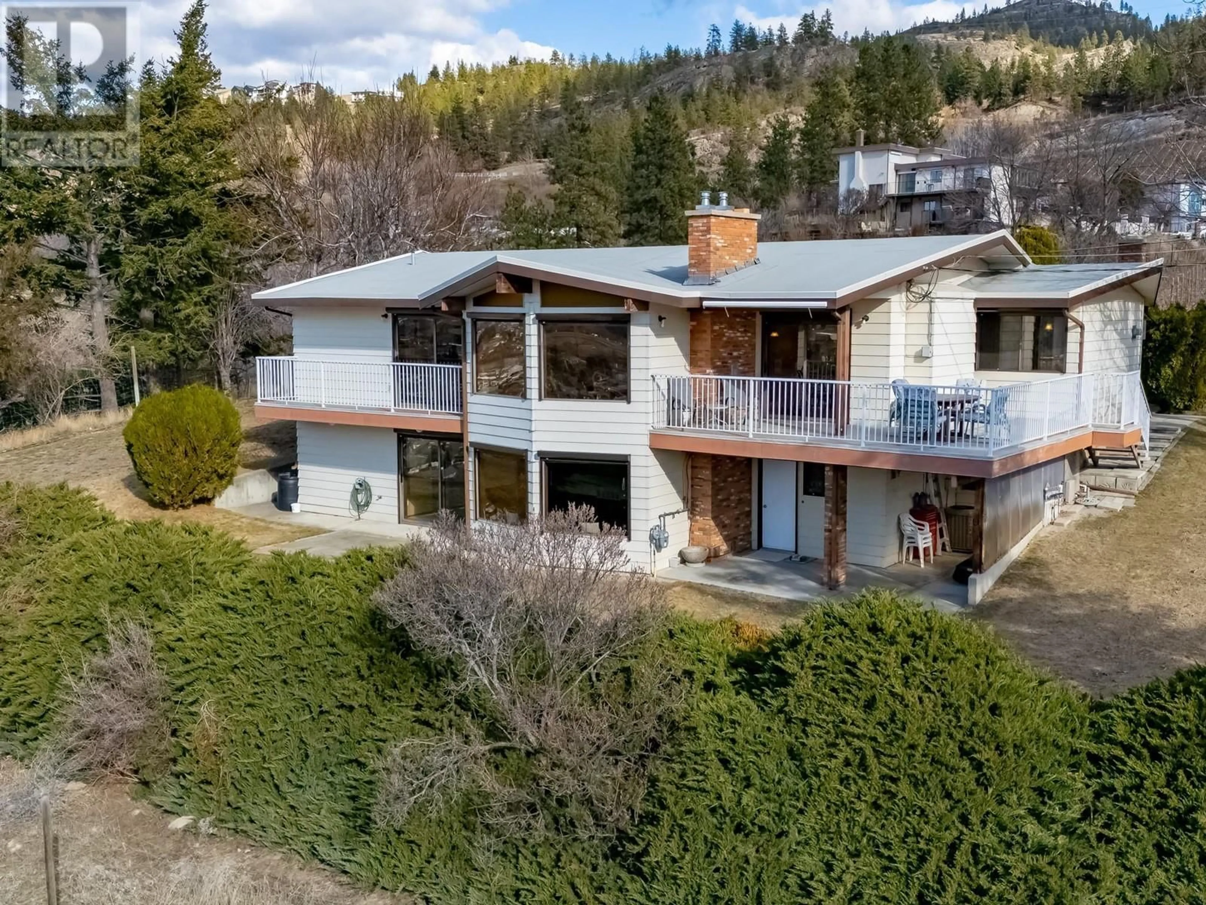 A pic from outside/outdoor area/front of a property/back of a property/a pic from drone, building for 105 Spruce Road, Penticton British Columbia V2A8V9