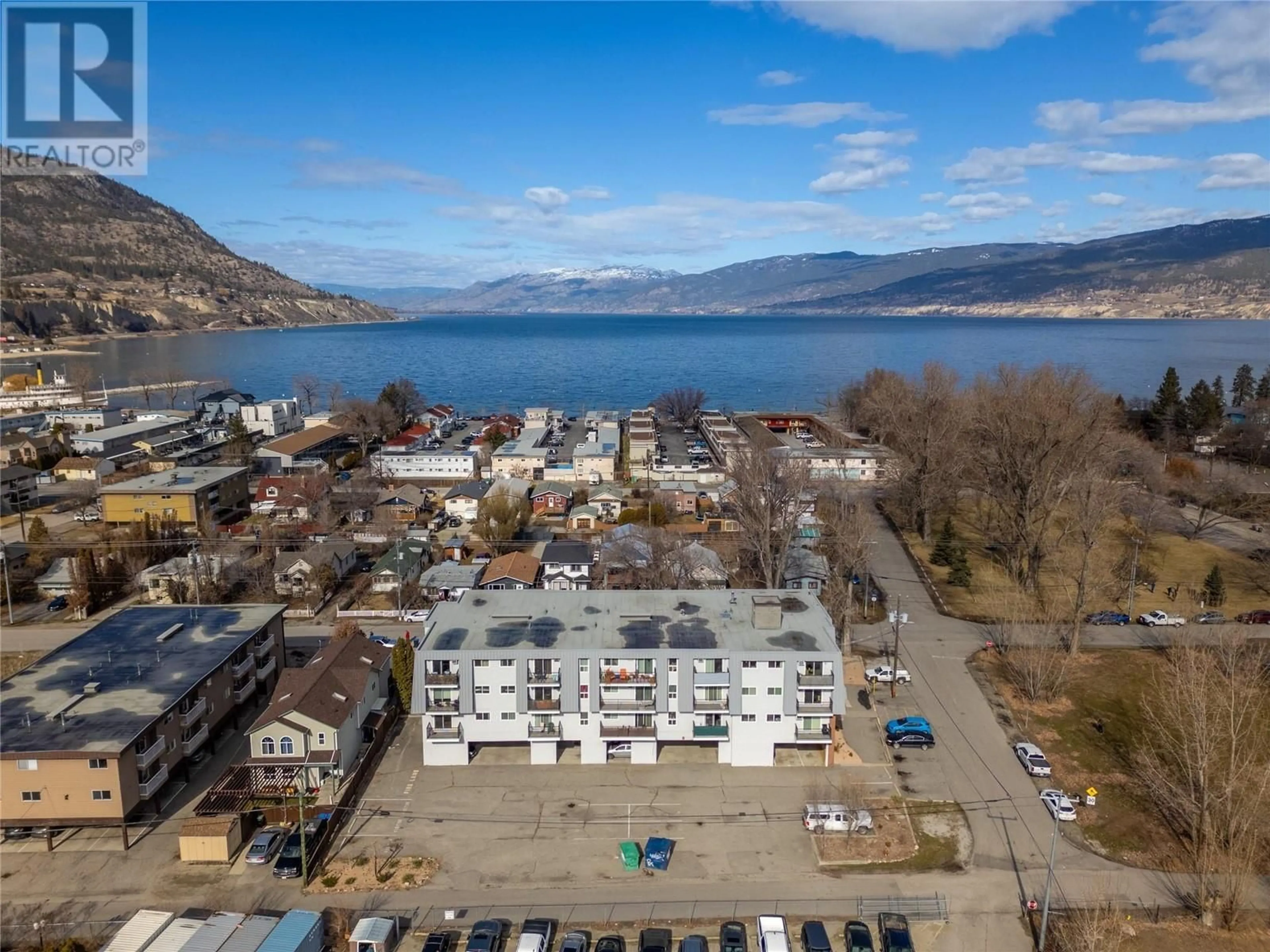 A pic from outside/outdoor area/front of a property/back of a property/a pic from drone, water/lake/river/ocean view for 922 Dynes Avenue Unit# 301, Penticton British Columbia V2A7X7